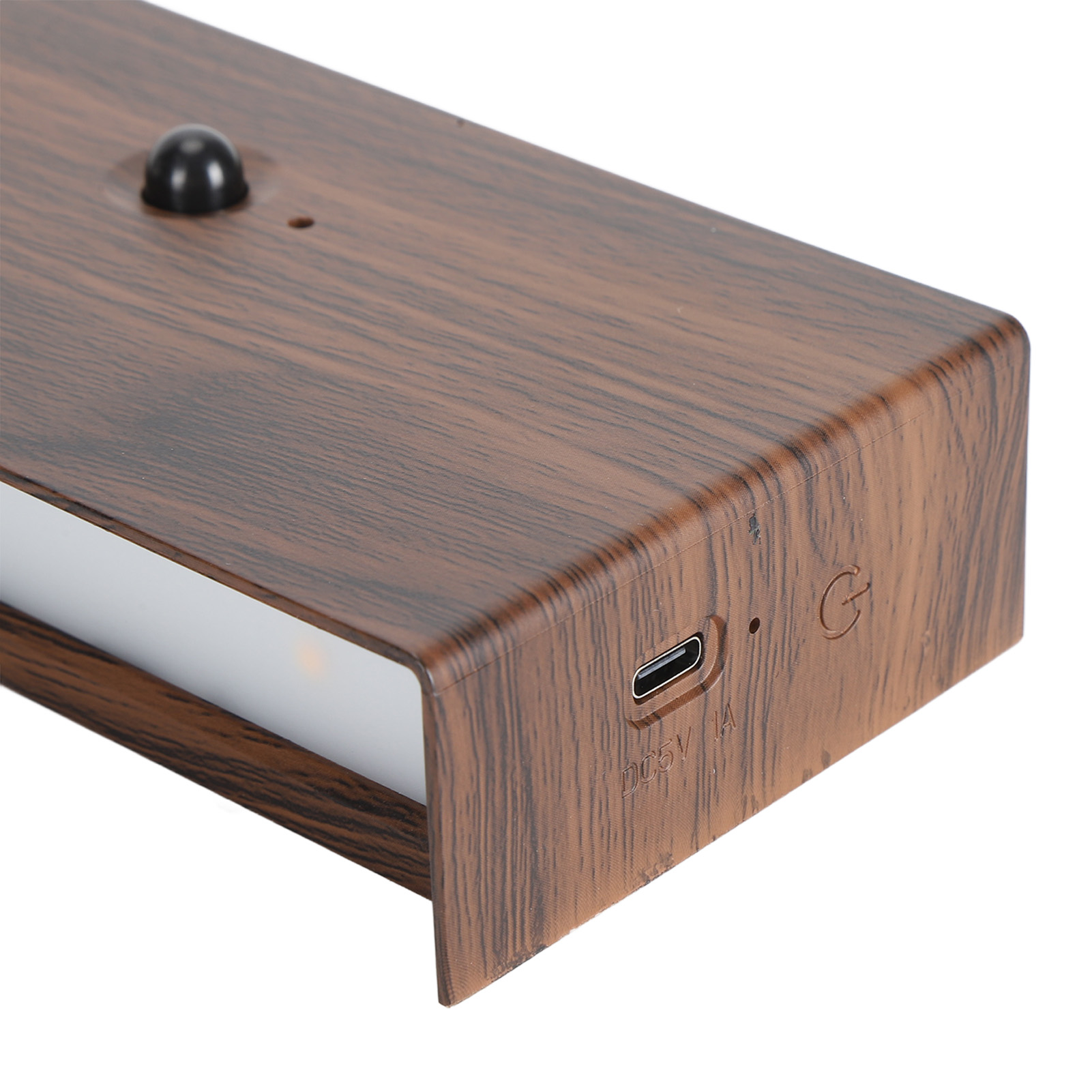 Rechteckiges Licht in Holzoptik mit einem berührungsempfindlichen Knopf und USB-Anschluss. Das Licht ist an.