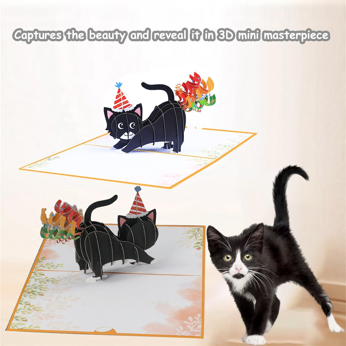 Zwei Pop-up-Karten mit schwarzen Katzen mit Partyhüten. Eine echte schwarz-weiße Katze ist unten rechts.