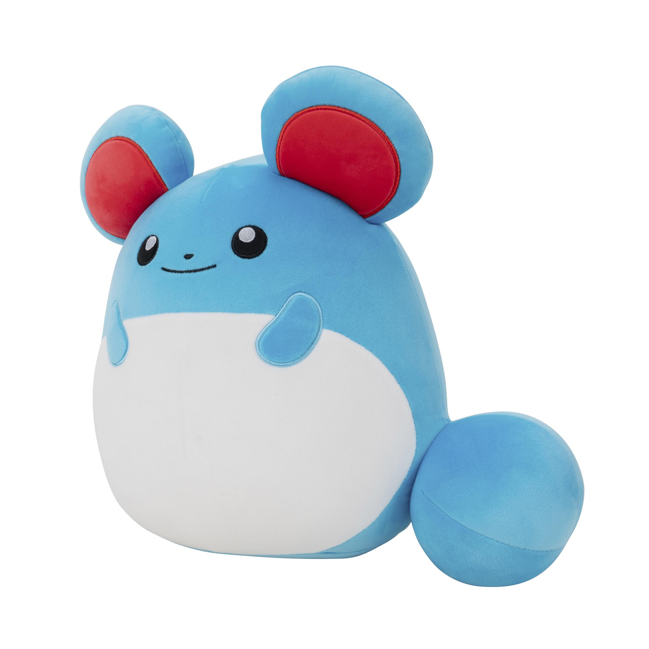 Peluche bleue en forme de personnage Pokémon. Elle a des oreilles rouges et un ventre blanc.