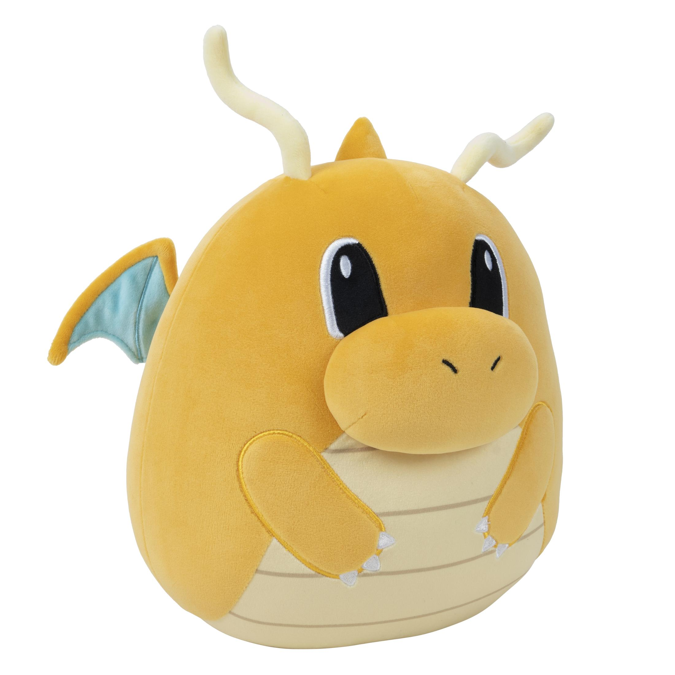 Une peluche Dragonite jaune sur fond blanc.