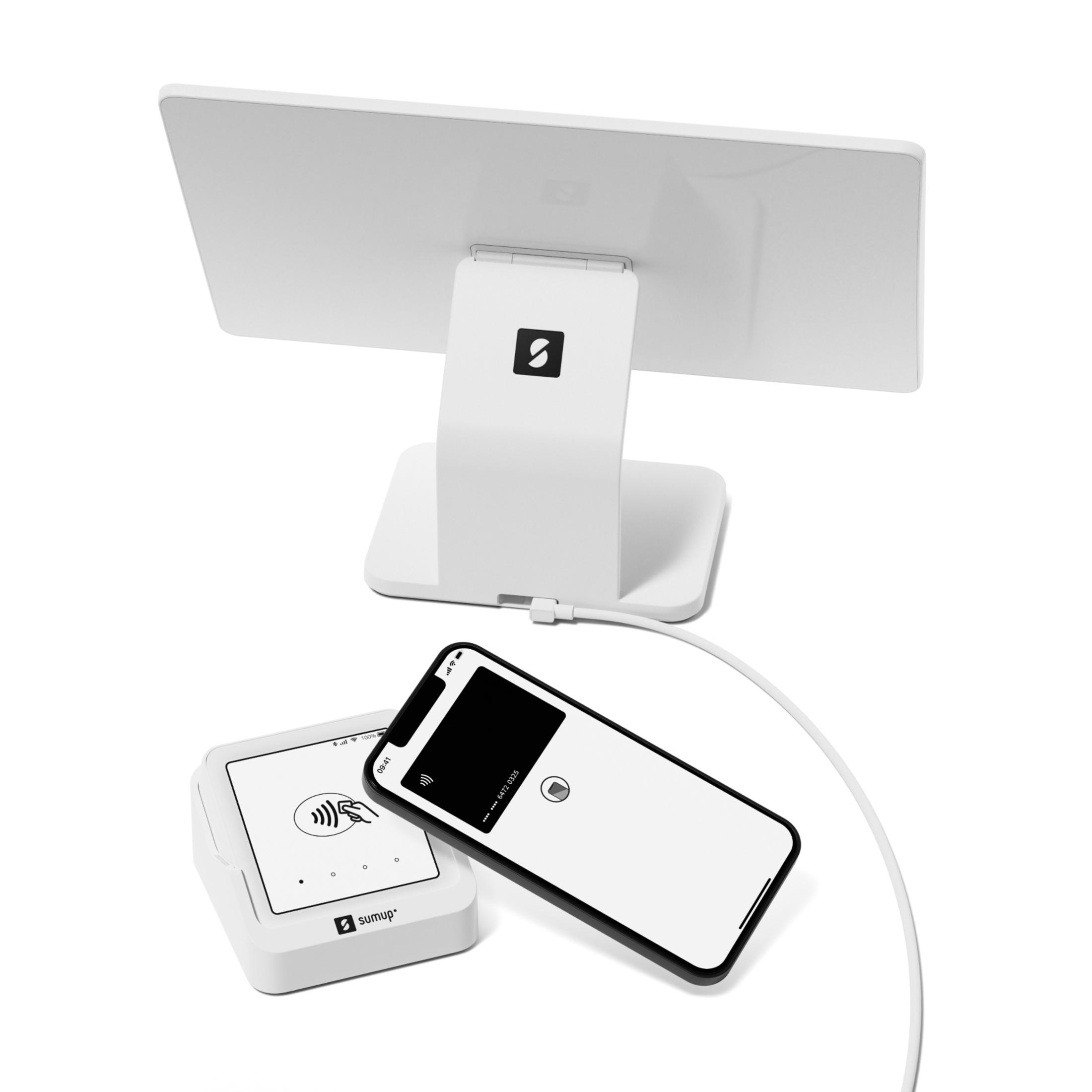 Una terminal de pago blanca con una tableta y un teléfono. Un cable blanco está conectado.