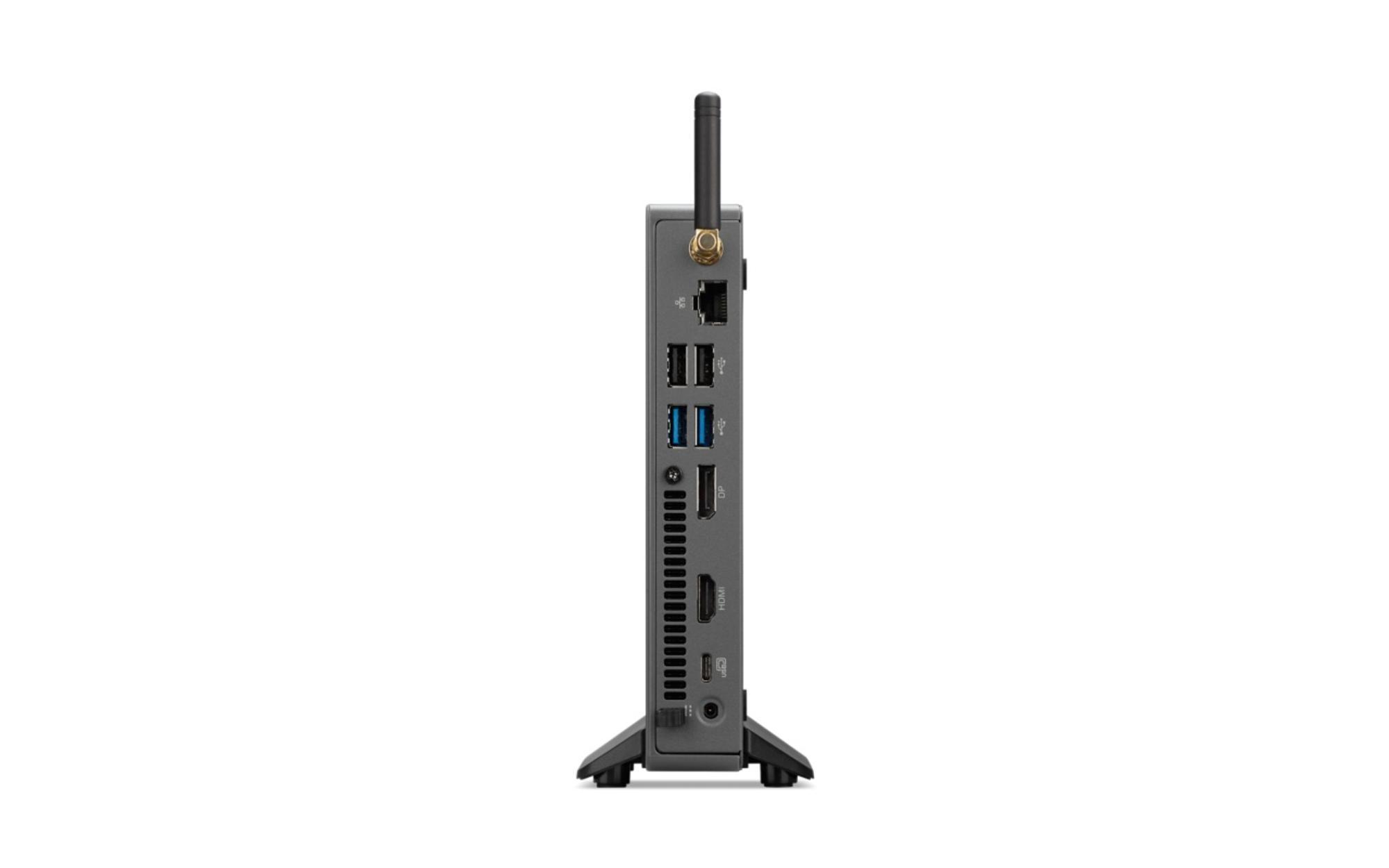 Un piccolo computer nero con porte e un'antenna è in posizione verticale.