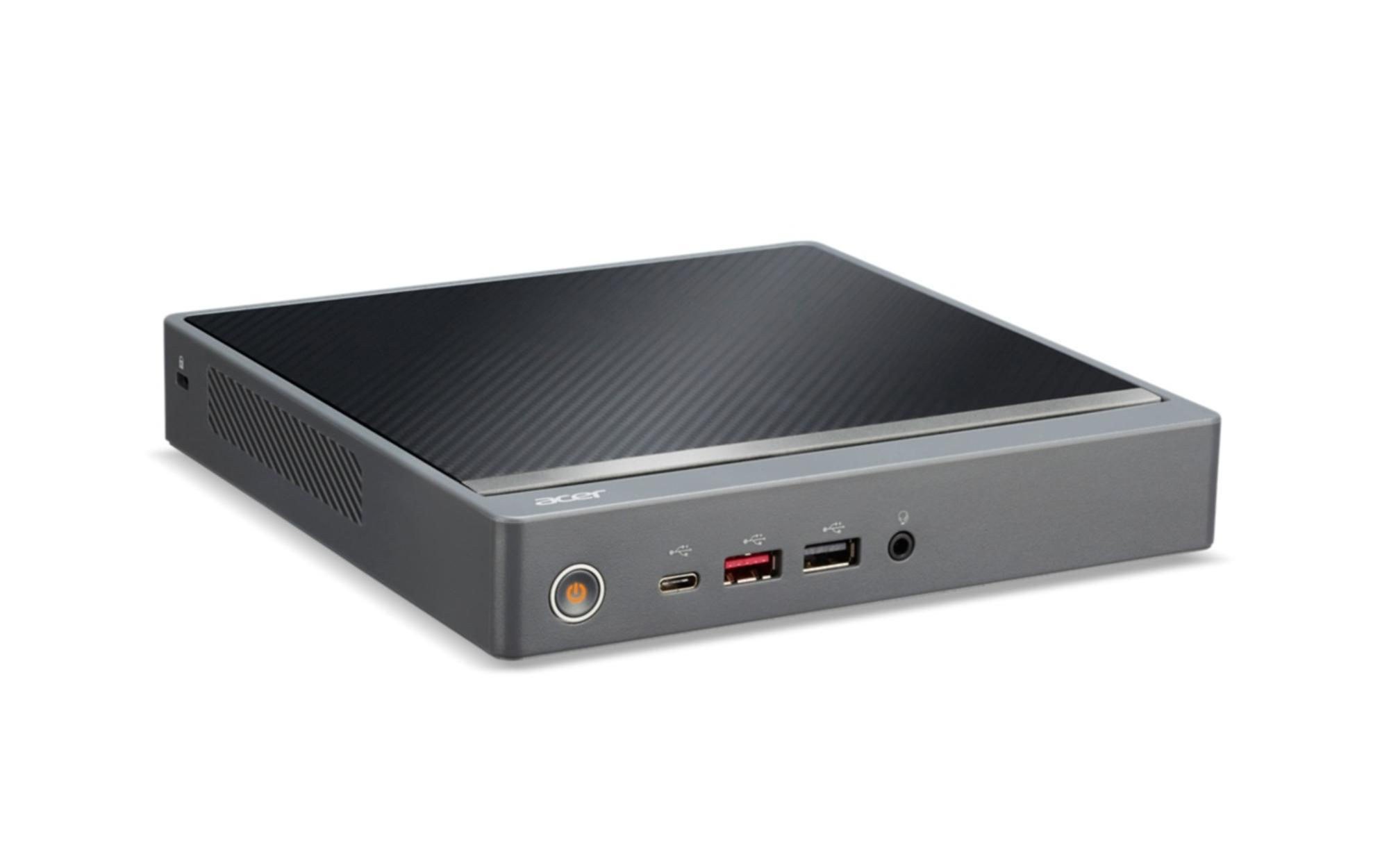 Un computer desktop Acer grigio con parte superiore nera e porte laterali.