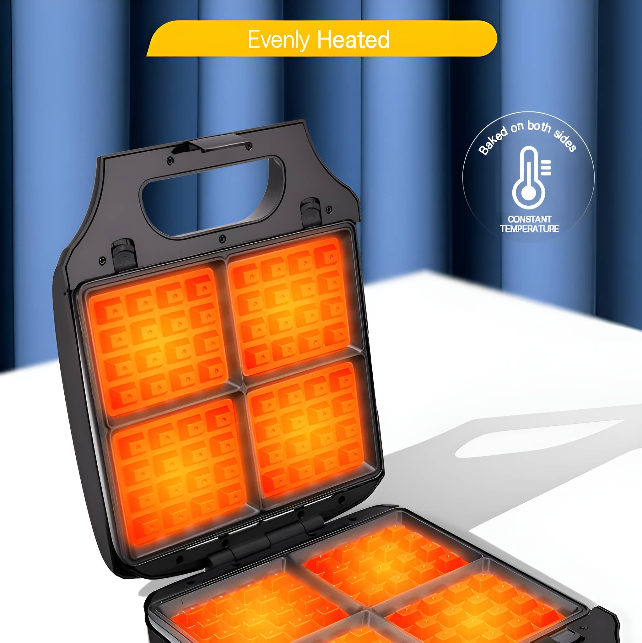 Geöffnete schwarze Waffeleisen mit 4 leuchtend orangefarbenen Waffelkammern. Text: 'Evenly Heated'.