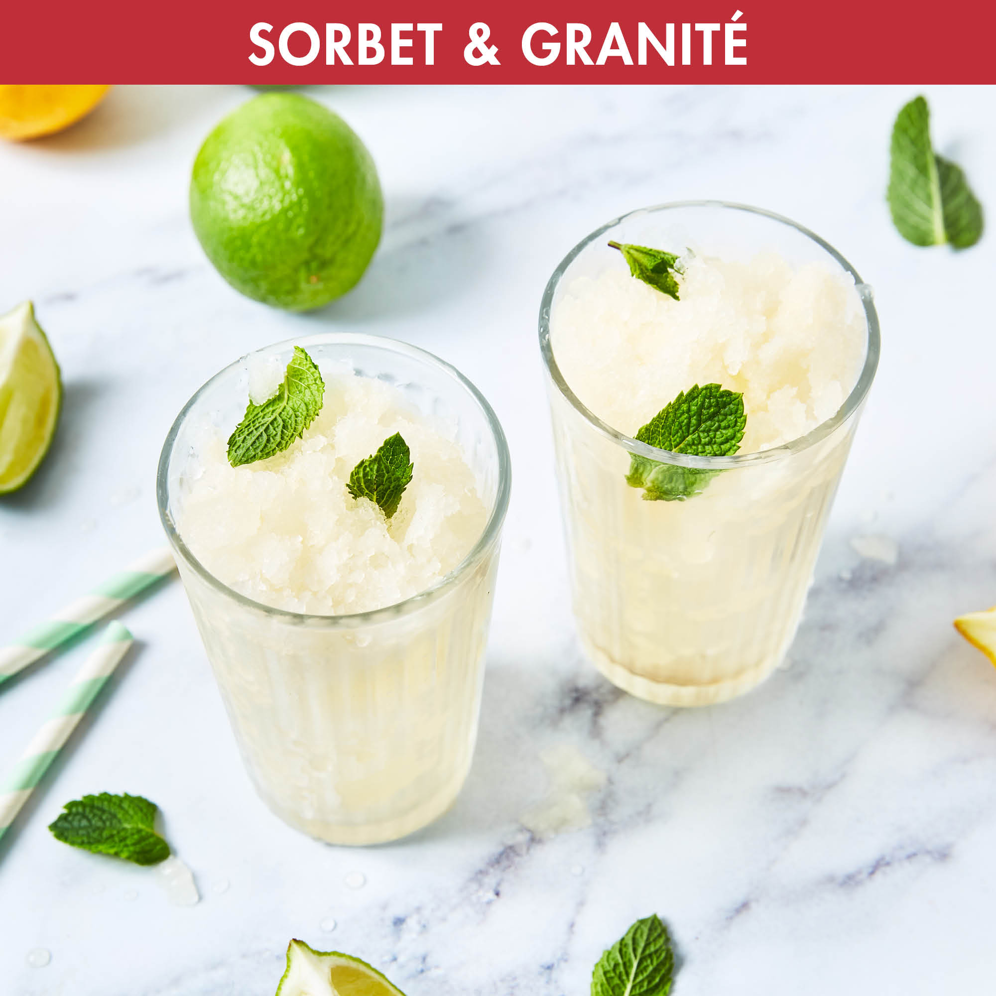 Two glasses with sorbet and mint leaves, with lime and a straw on white background.