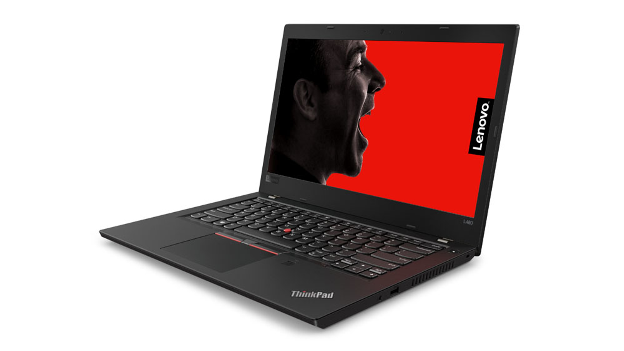 Schwarzer Lenovo-Laptop offen, zeigt ein schreiendes Gesicht auf dem Bildschirm, roter Hintergrund, weiße Oberfläche.