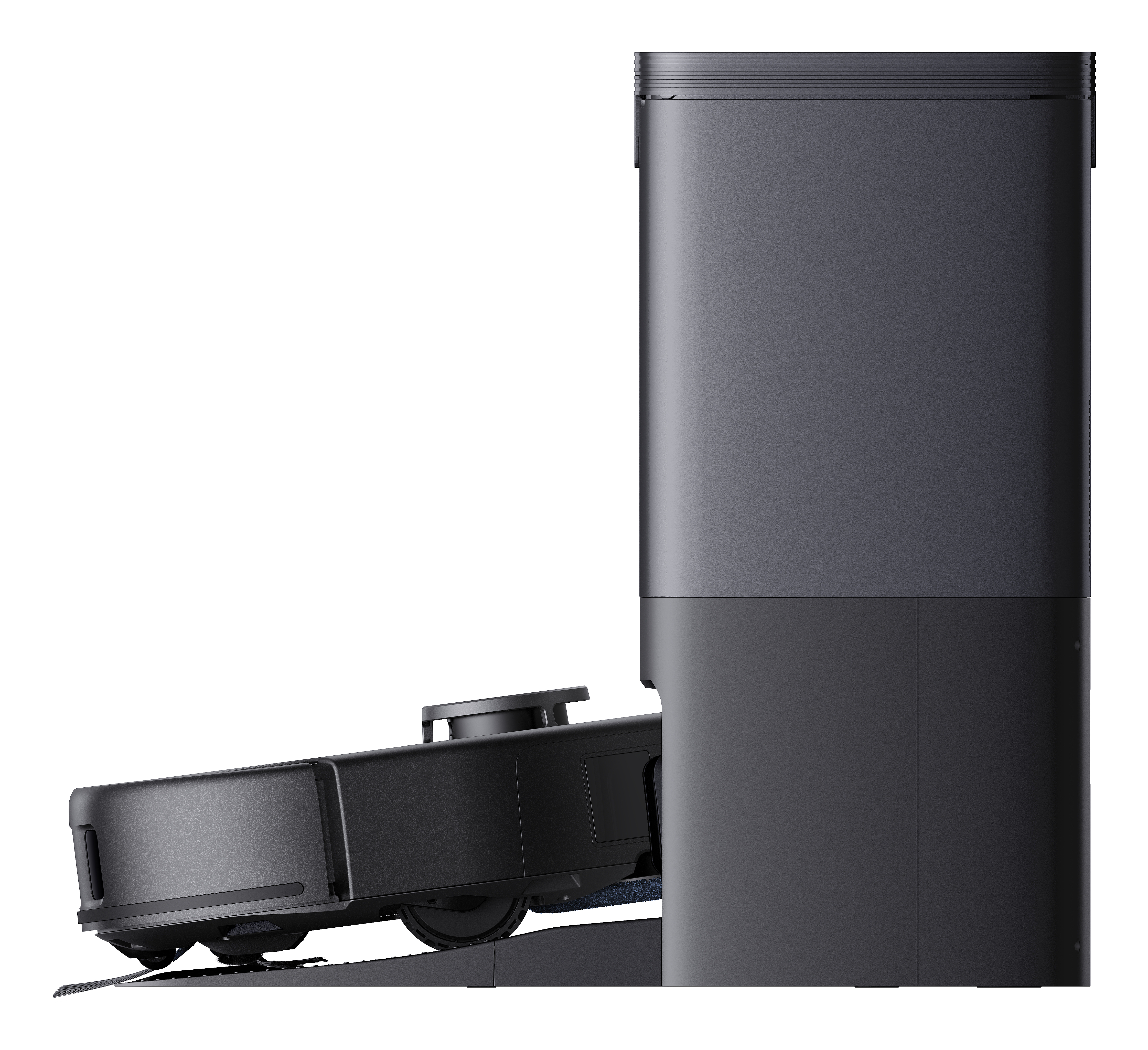 Czarny robot odkurzający na stacji ładowania obok wysokiej czarnej podstawy.