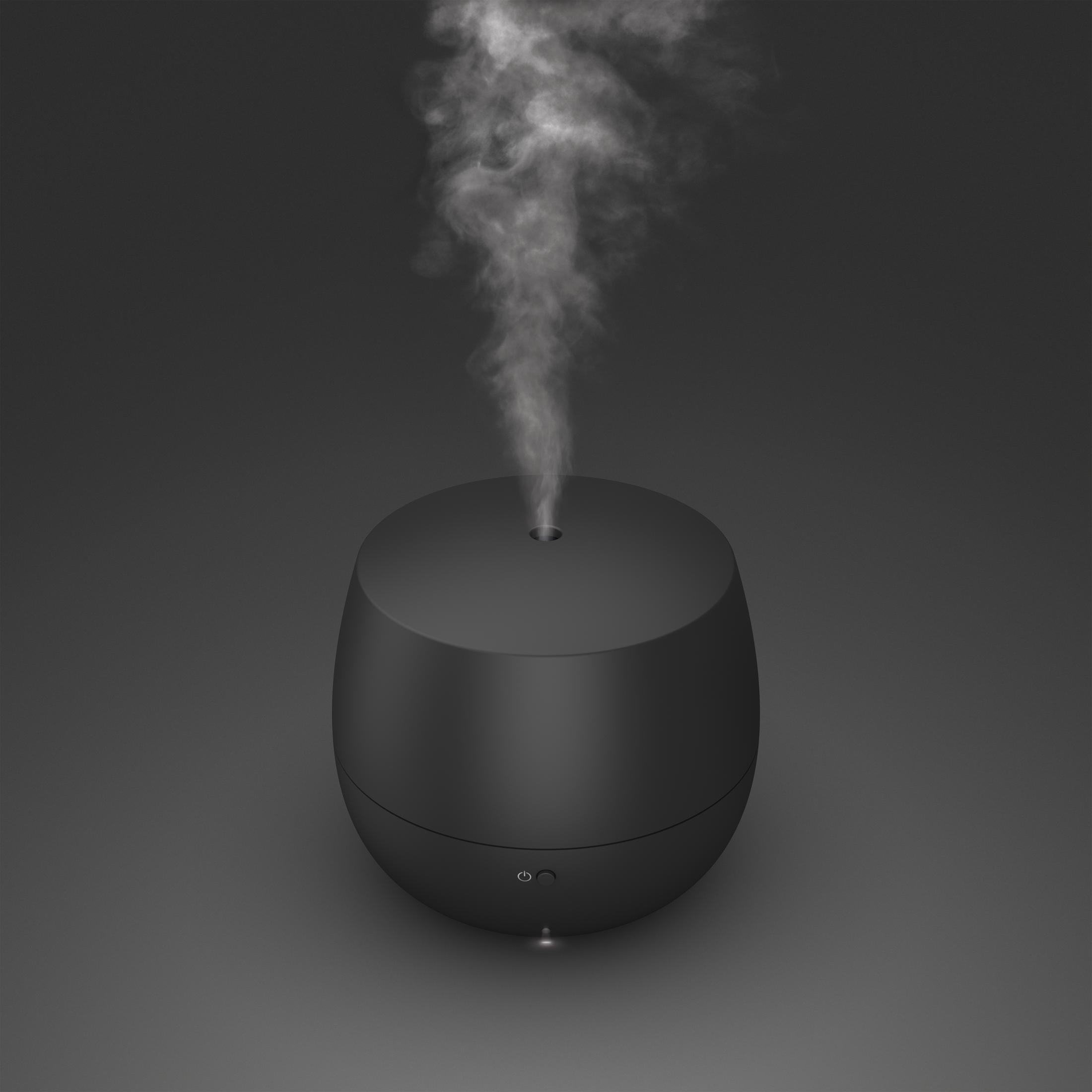 A black oval-shaped diffuser releasing steam on a dark gray background.