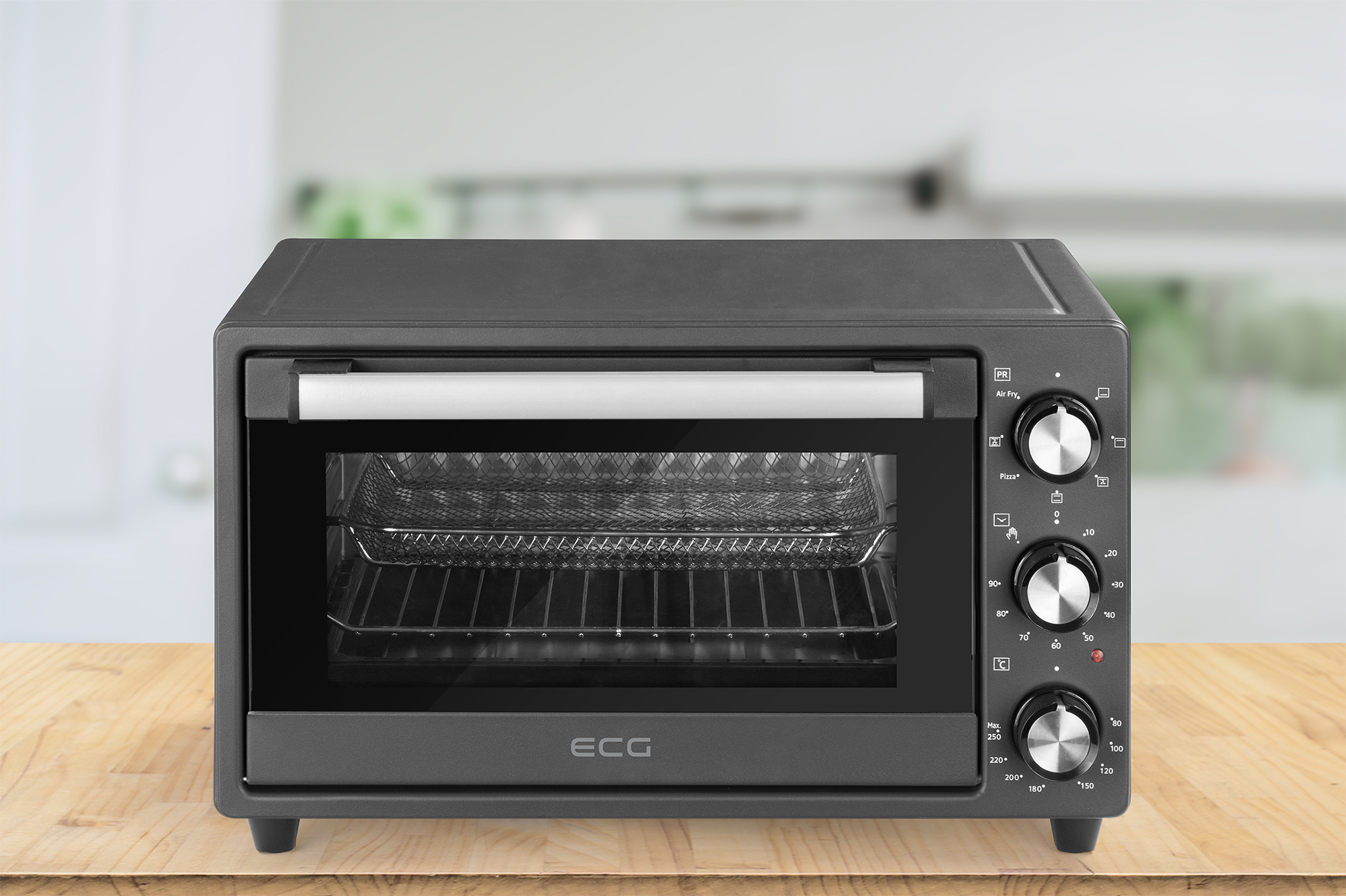 Schwarzer Tischbackofen mit Glastür, Bedienknöpfen und Metallrost im Inneren.
