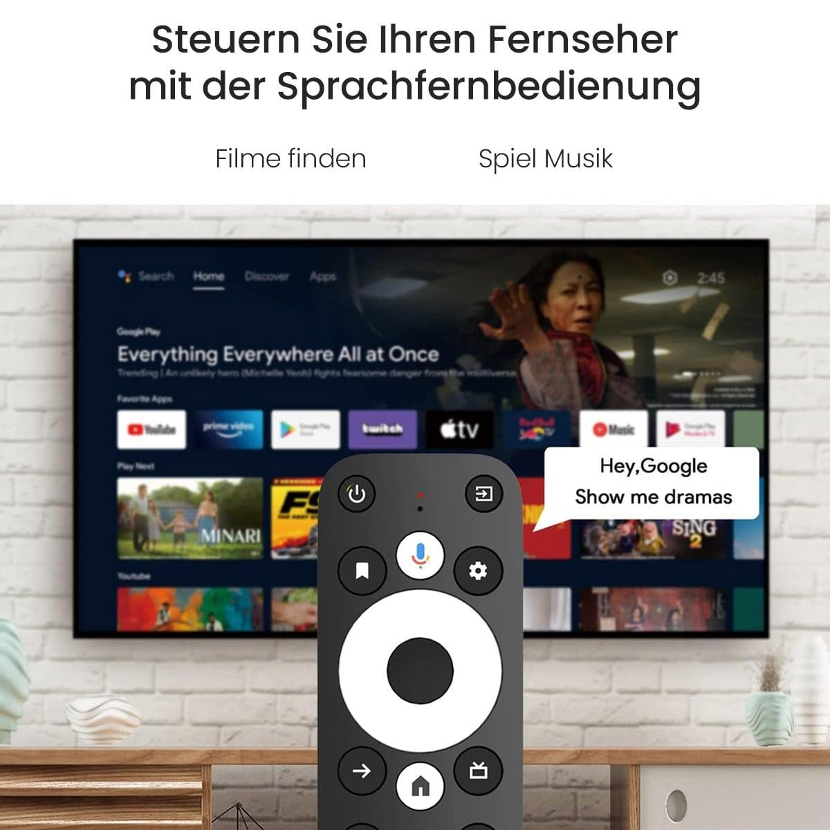 Ein Fernsehbildschirm mit einer Fernbedienung im Vordergrund. Der Bildschirm zeigt einen Film und den Google Assistant.
