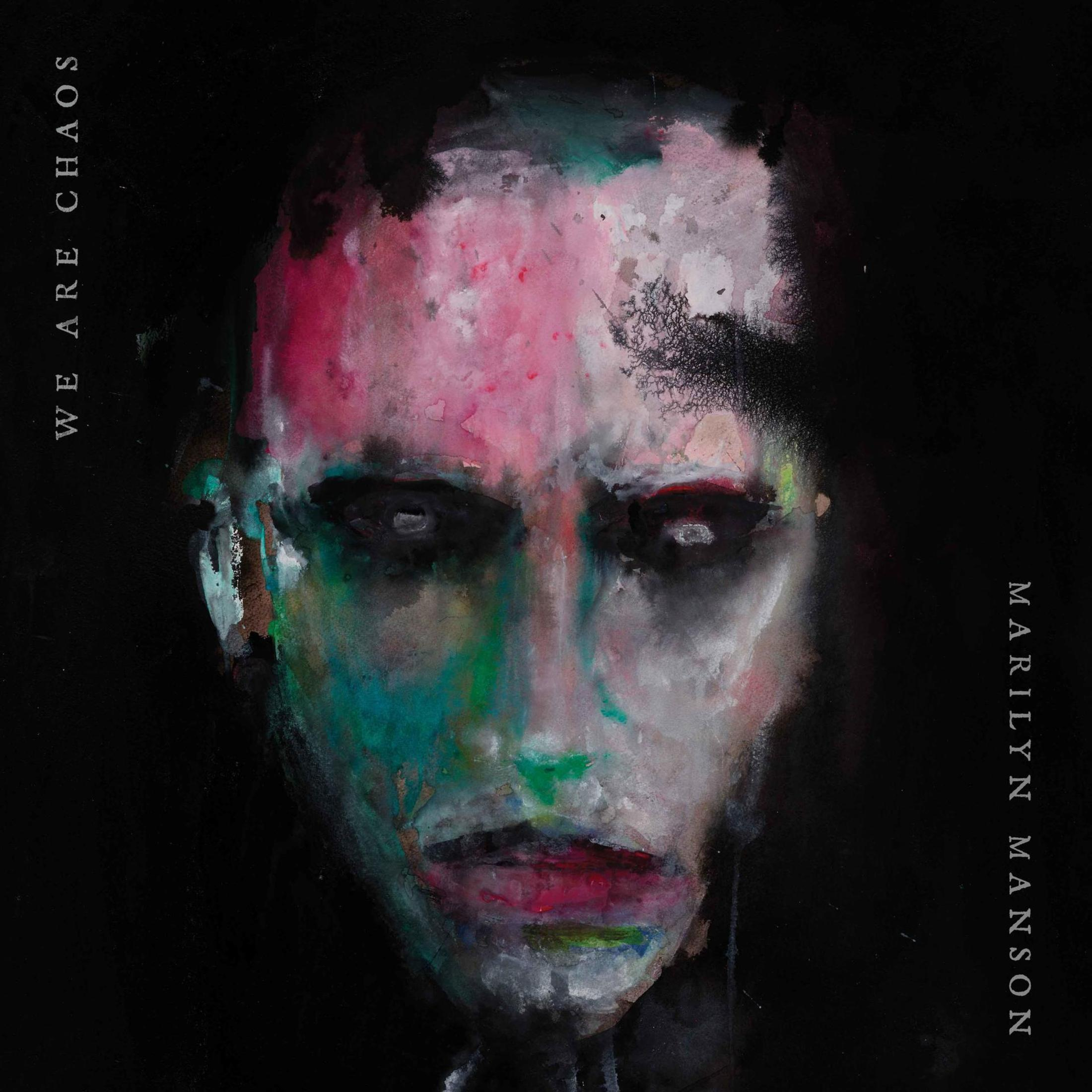 Okładka albumu Marilyn Manson. Twarz z czerwoną, zieloną i białą farbą na czarnym tle.