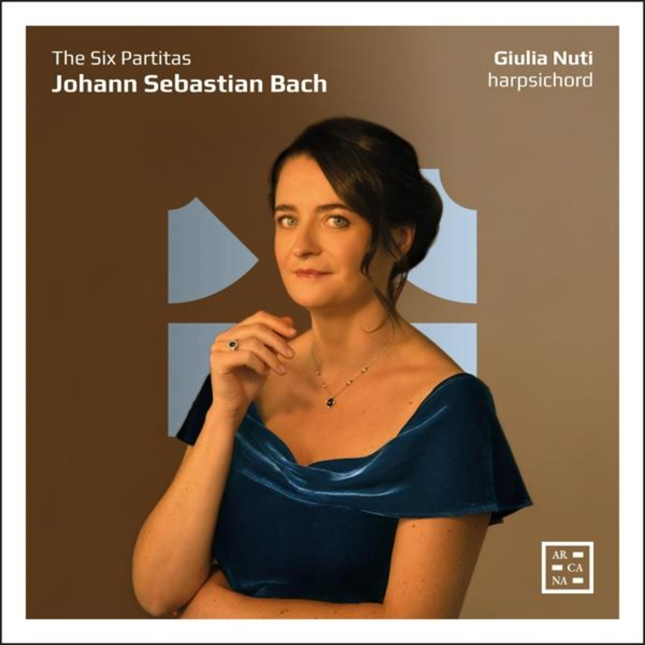 Copertina dell'album con una donna in abito blu, testo: The Six Partitas, Johann Sebastian Bach e Giulia Nuti.