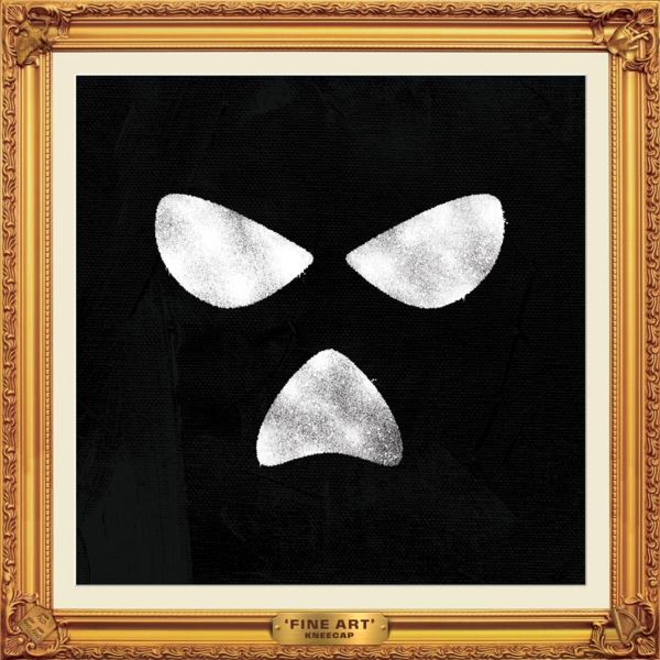 Œuvre d'art : Un motif en forme de visage avec trois formes blanches sur fond noir, dans un cadre doré.