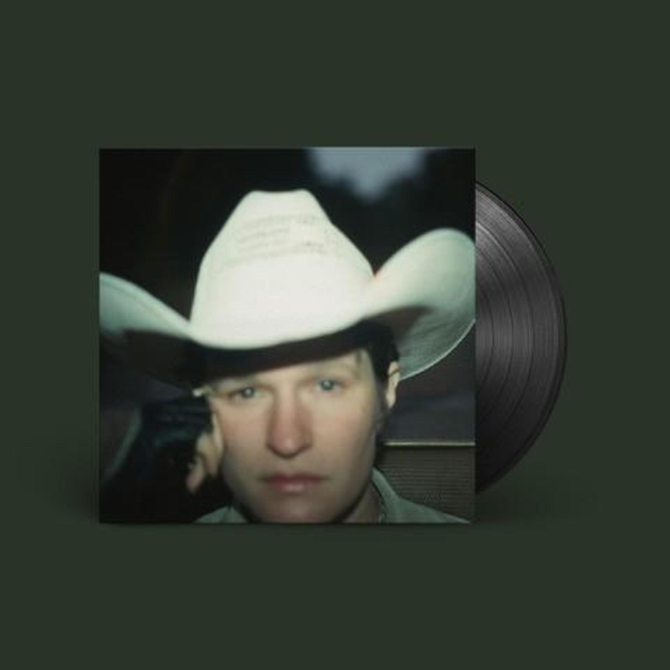 Copertina dell'album. Un uomo con un cappello da cowboy guarda la fotocamera. Un disco in vinile a destra.