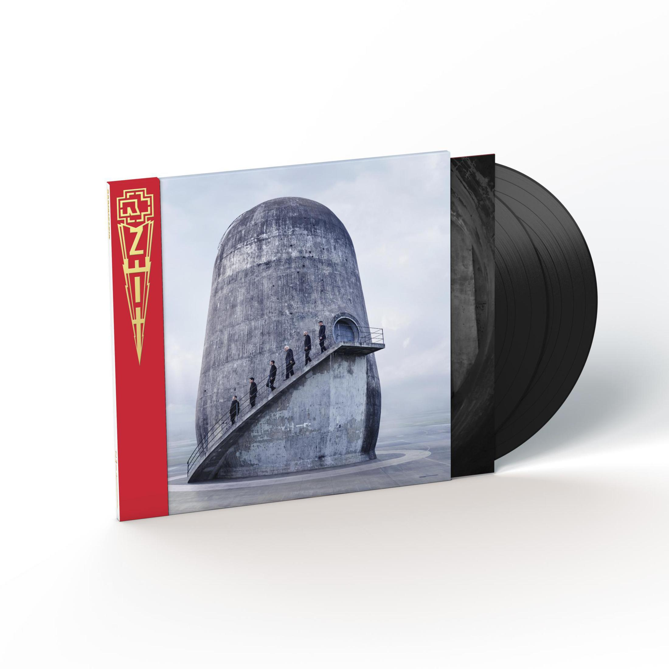 Copertina dell'album con un edificio cilindrico e persone che camminano su una scala. Disco in vinile visibile.