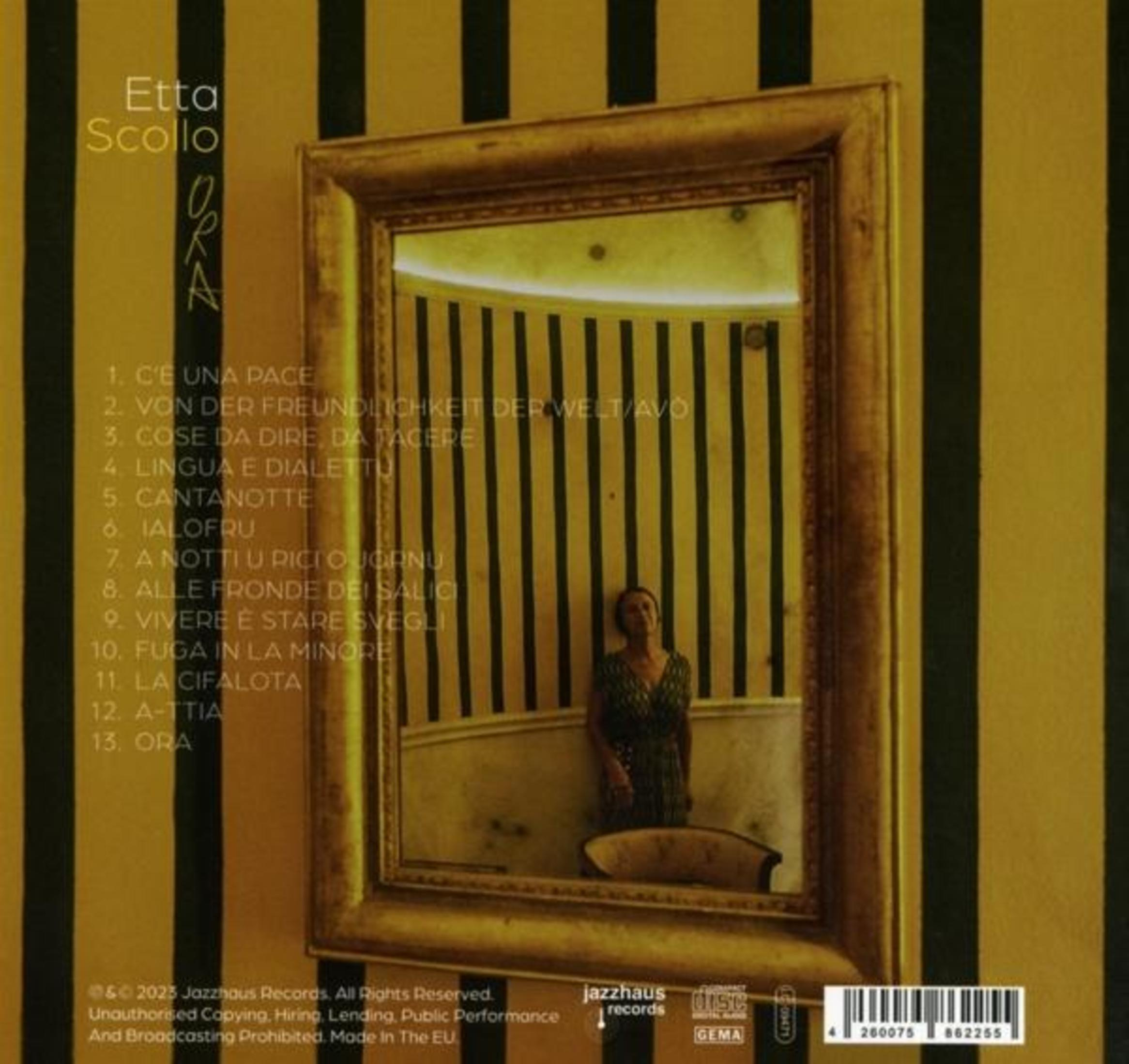 Copertina dell'album: Donna in uno specchio, pareti dorate. Testo: Etta Scollo, Ora.