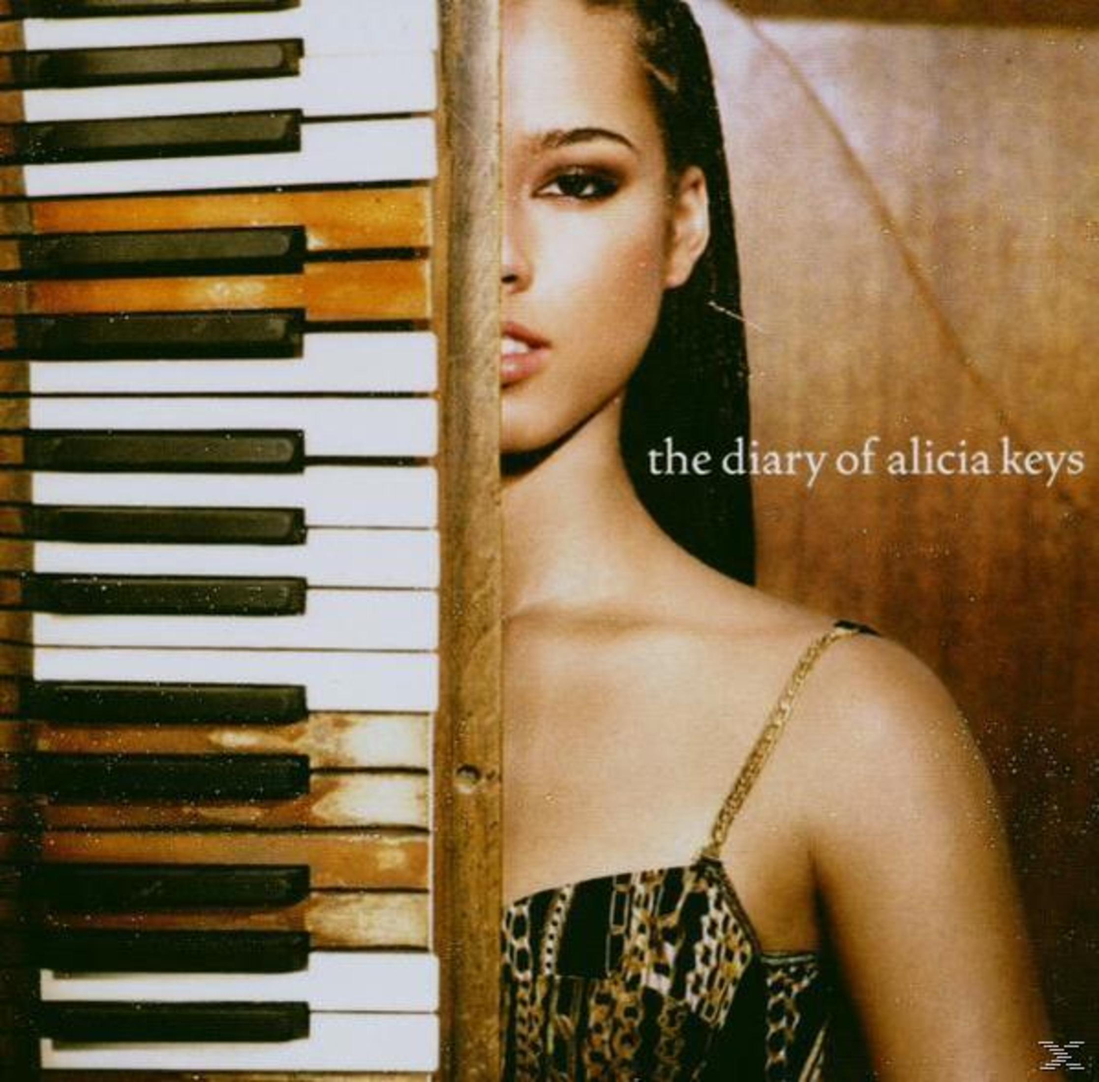 Pochette d'album d'Alicia Keys. Femme avec la moitié du visage visible, touches de piano à gauche.