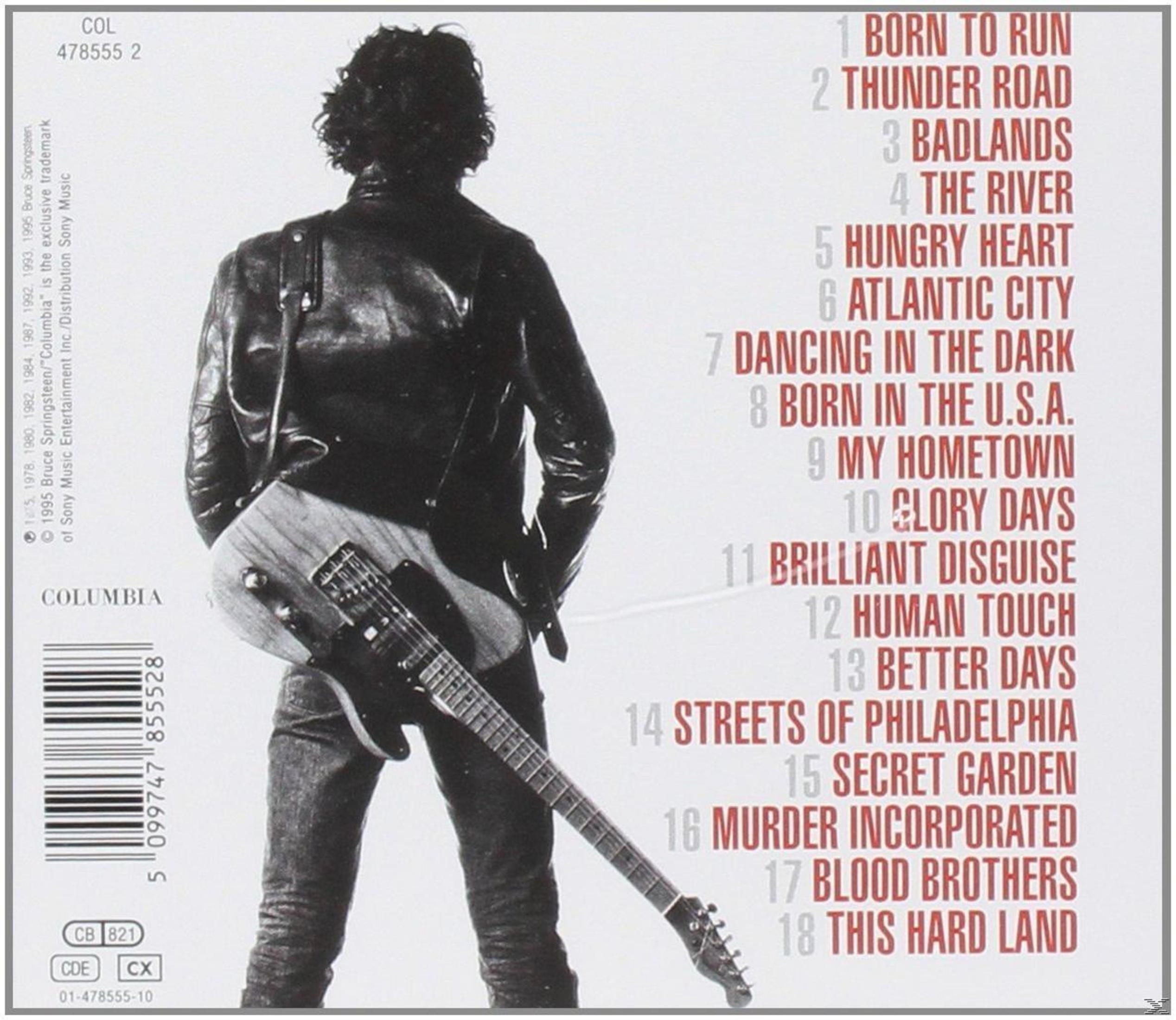Achterkant van album: Bruce Springsteen met gitaar, songtitels staan vermeld met albumdetails.
