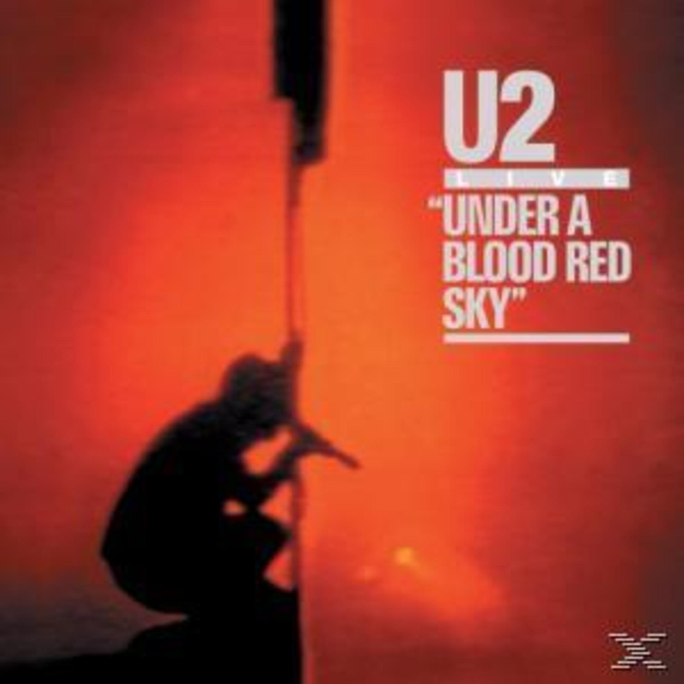 Albumhoes met U2-tekst en een afbeelding van een persoon die tegen een rode lucht een structuur beklimt.