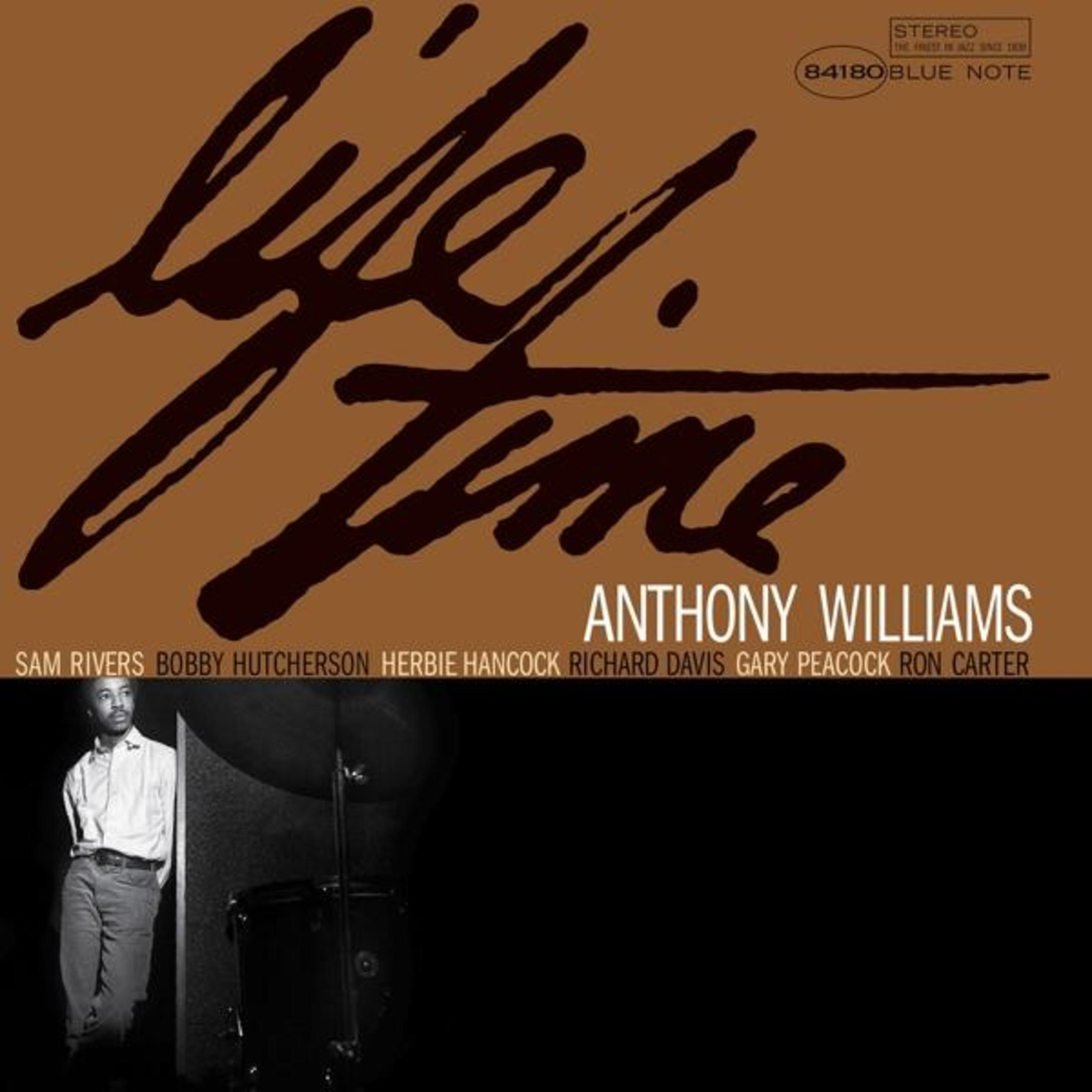 Albumhoes met tekst "Lifetime" over een foto van Anthony Williams en bandleden. Bruine achtergrond.