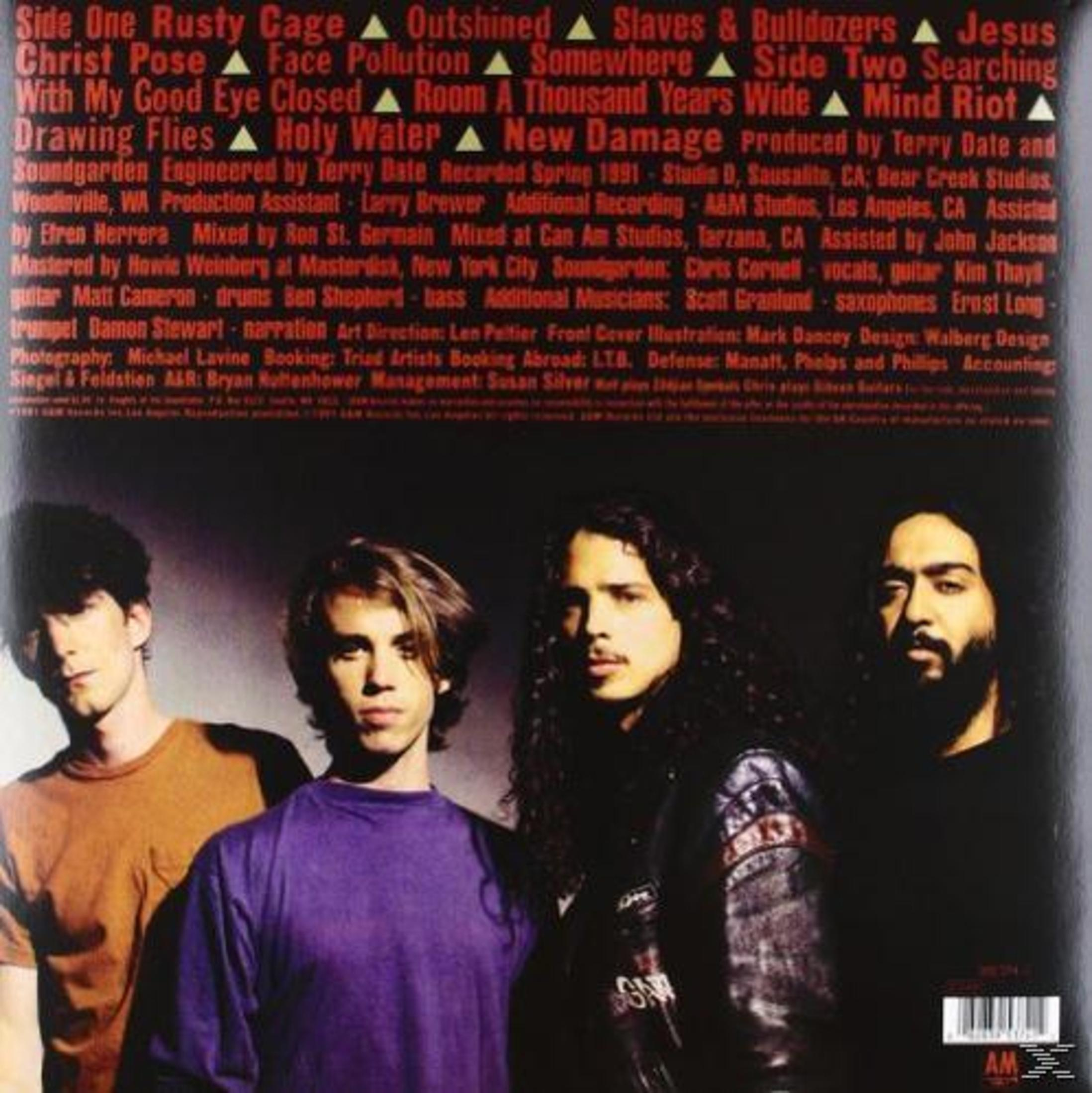 Copertina: Membri della band di fronte a uno sfondo scuro. Soundgarden - Badmotorfinger.