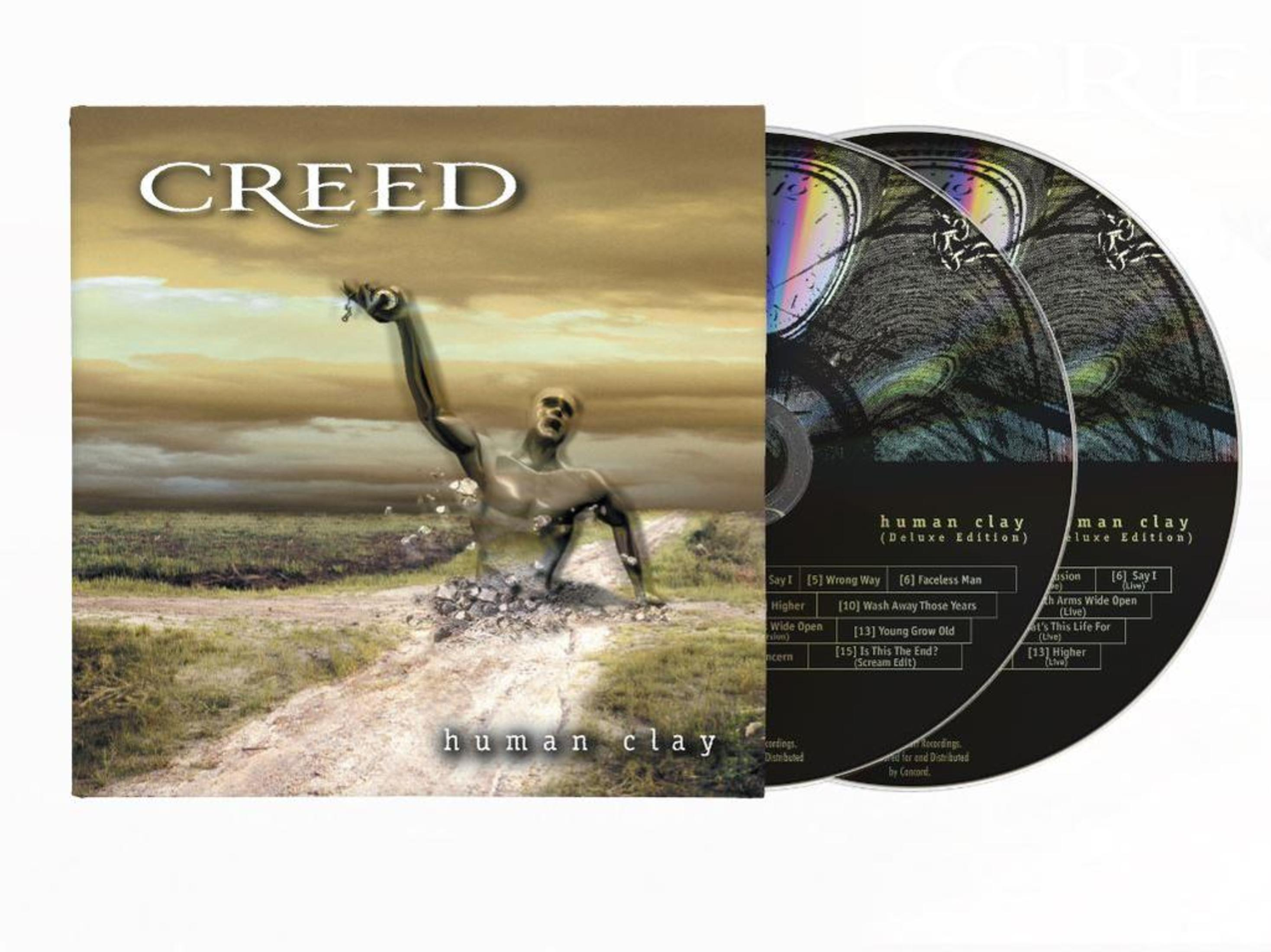 Portada de CD con un hombre emergiendo del suelo. Los CD son visibles.