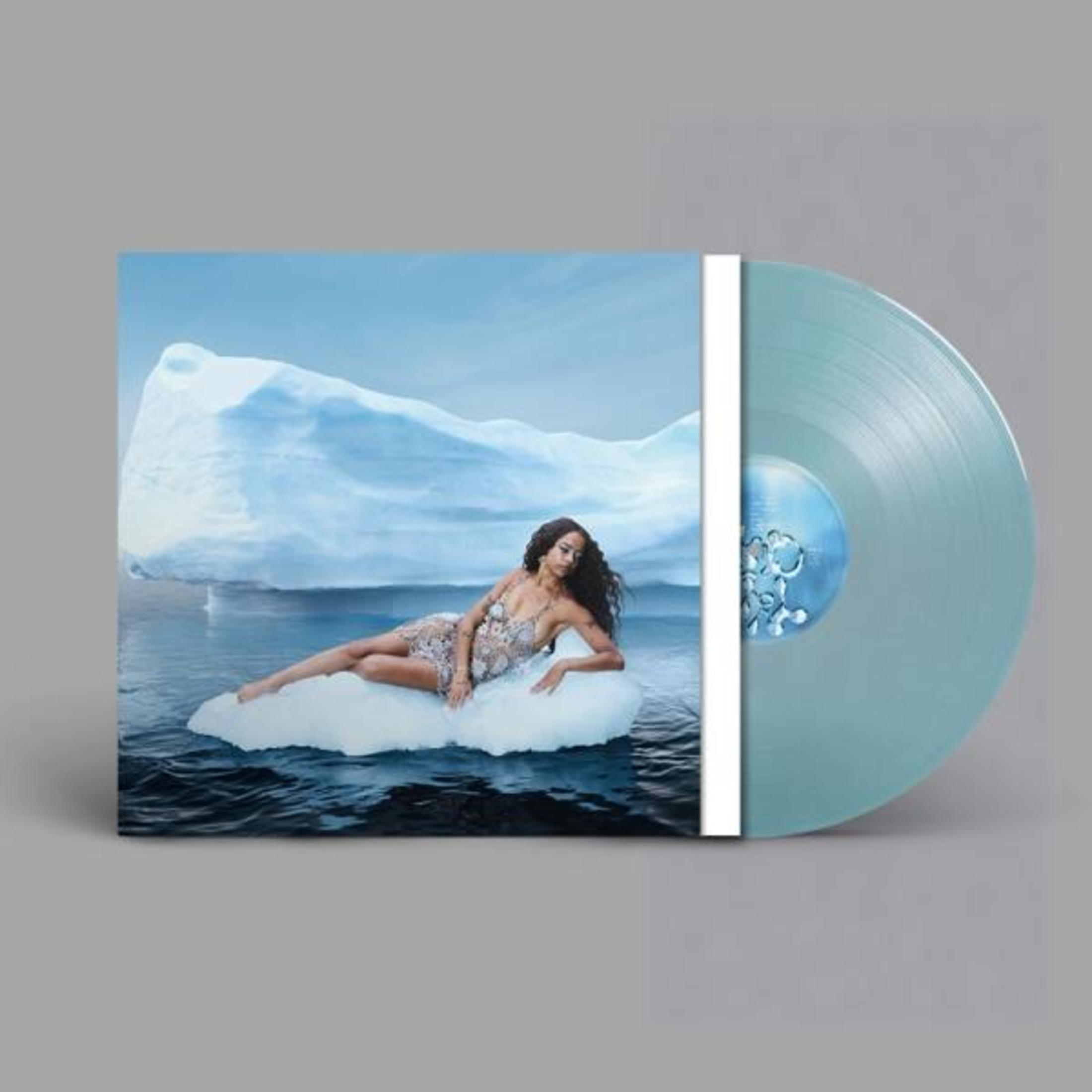 Copertina dell'album e disco in vinile. Donna in abito sul ghiaccio, iceberg sullo sfondo, acqua e cielo blu.