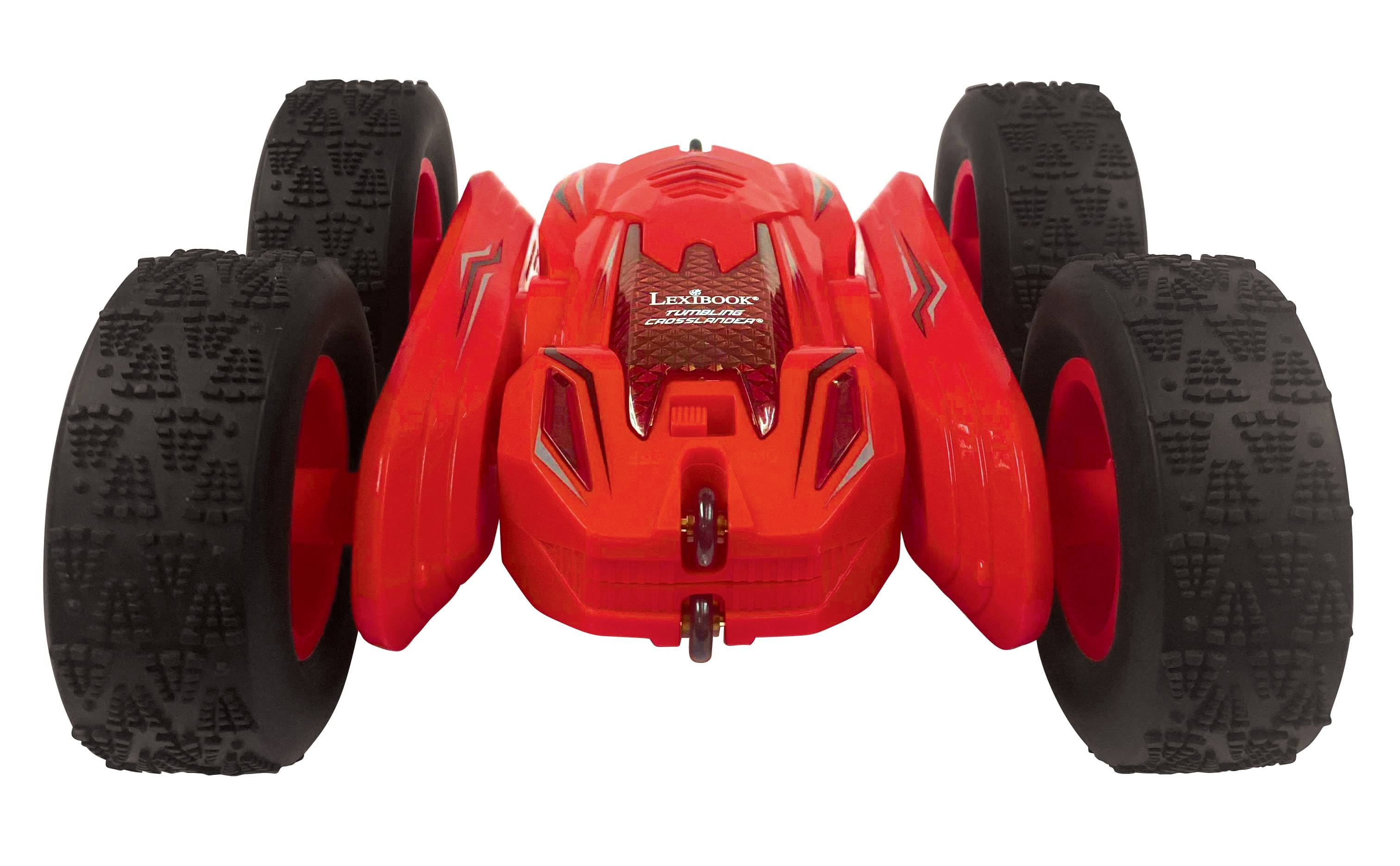Coche teledirigido rojo con ruedas grandes, inclinado hacia el espectador.