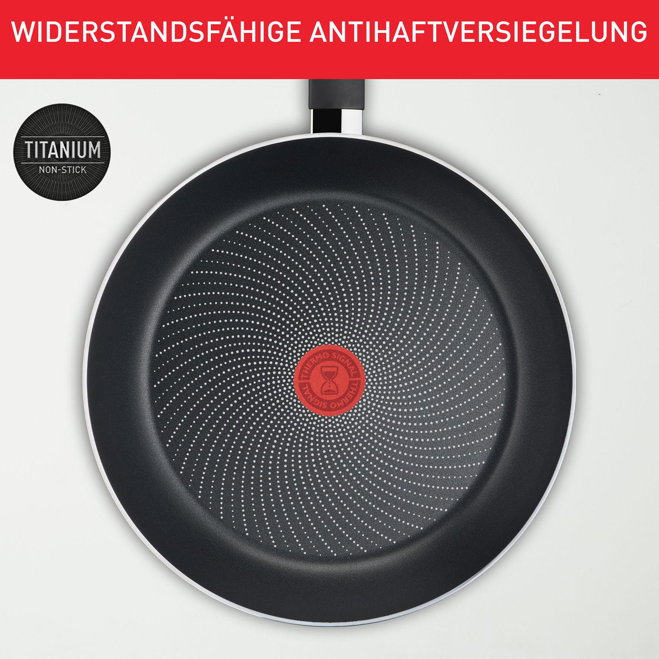A frying pan with a black interior and a silver rim. The logo and text are visible.