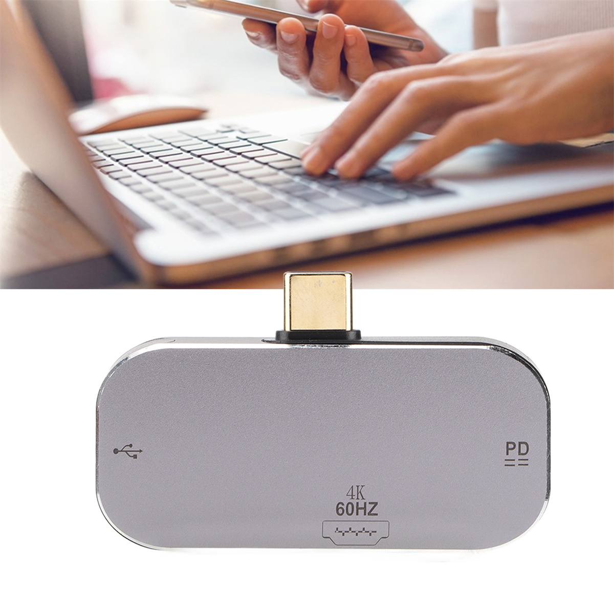 Ein silberner USB-C-Adapter mit einem Telefon und Laptop im Hintergrund. Auf dem Adapter stehen USB, USB-C und 4K 60Hz.