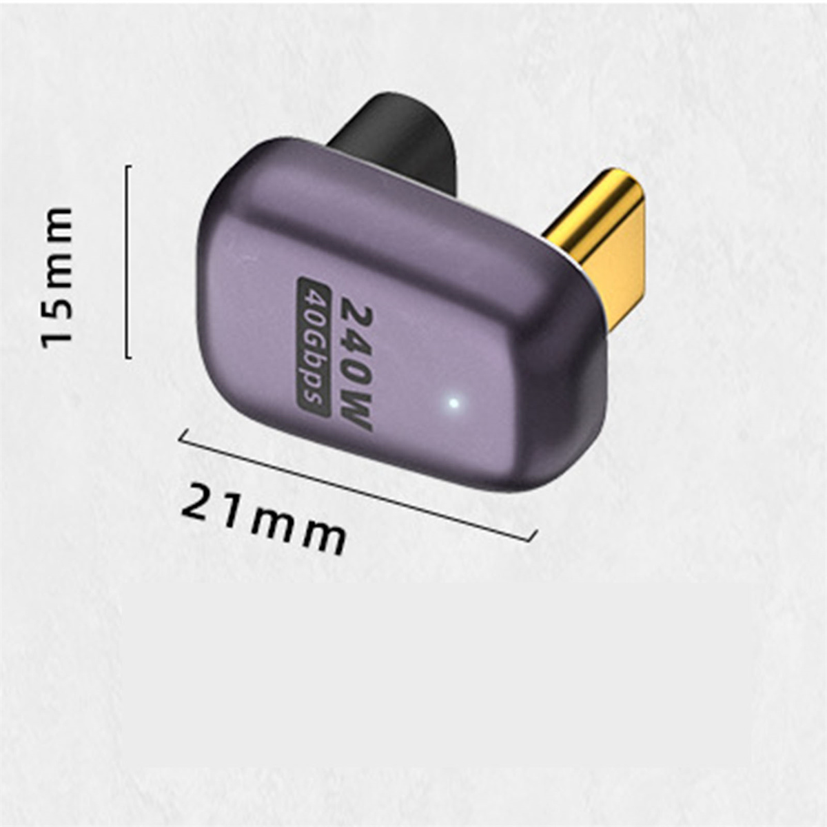 Ein kleines lila Gerät mit Text und Abmessungen, goldener Stecker.