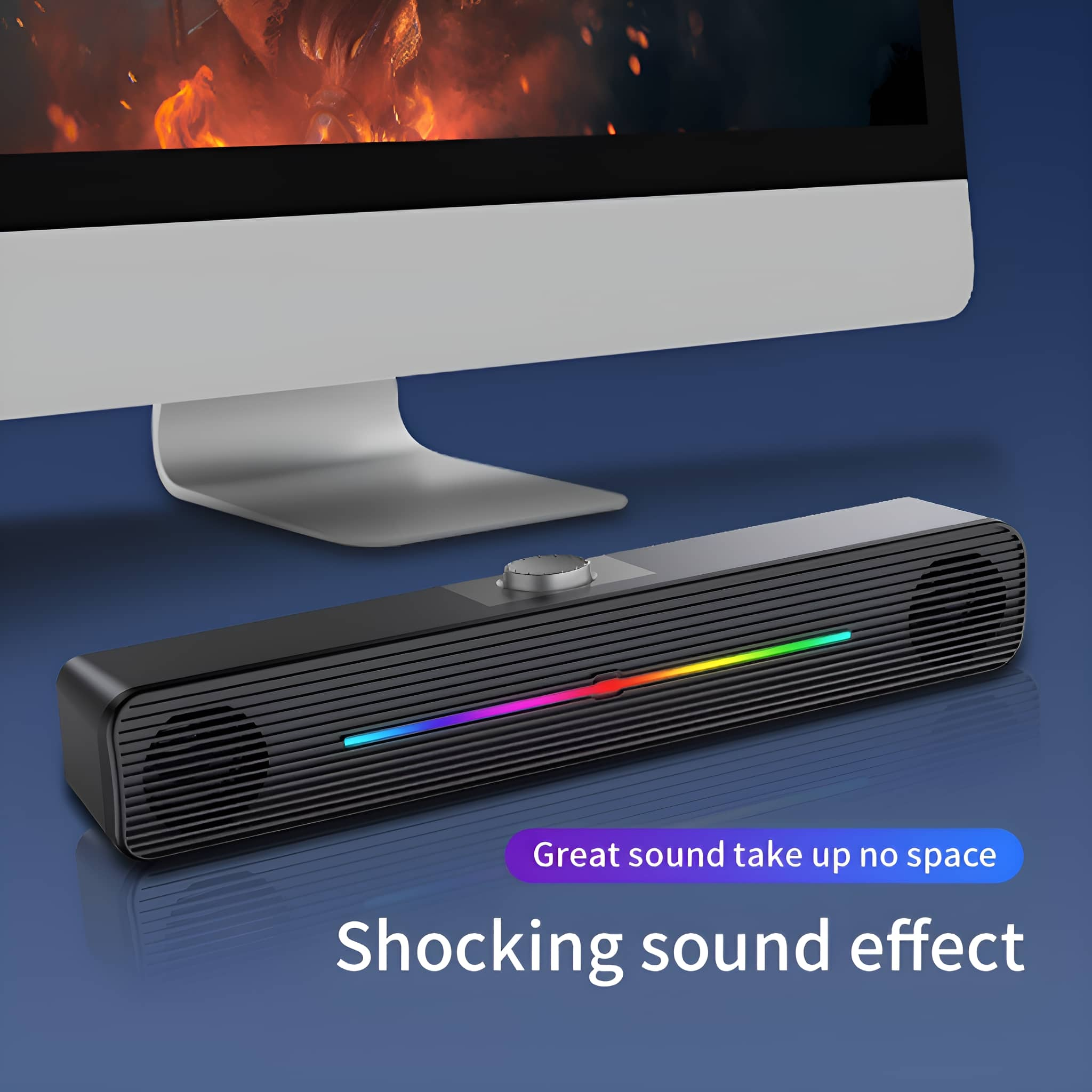 Schwarzer Lautsprecher mit Regenbogen-Lichtleiste unter Monitor. Text: "Toller Sound, kein Platz, Schockierender Soundeffekt".