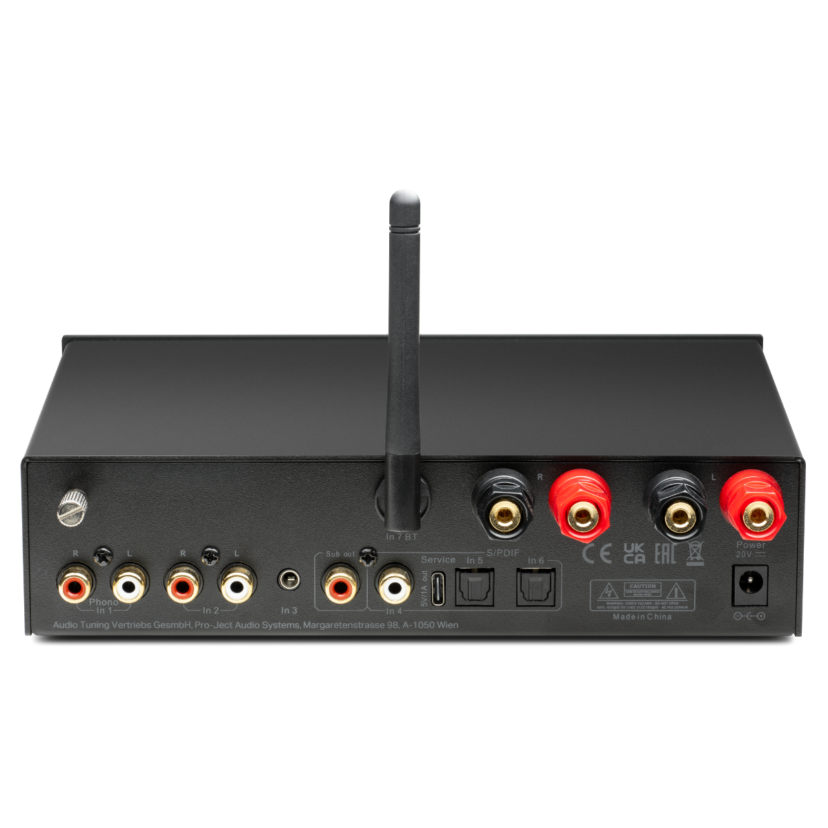 Czarny wzmacniacz audio, z anteną, wejściami/wyjściami i etykietami.