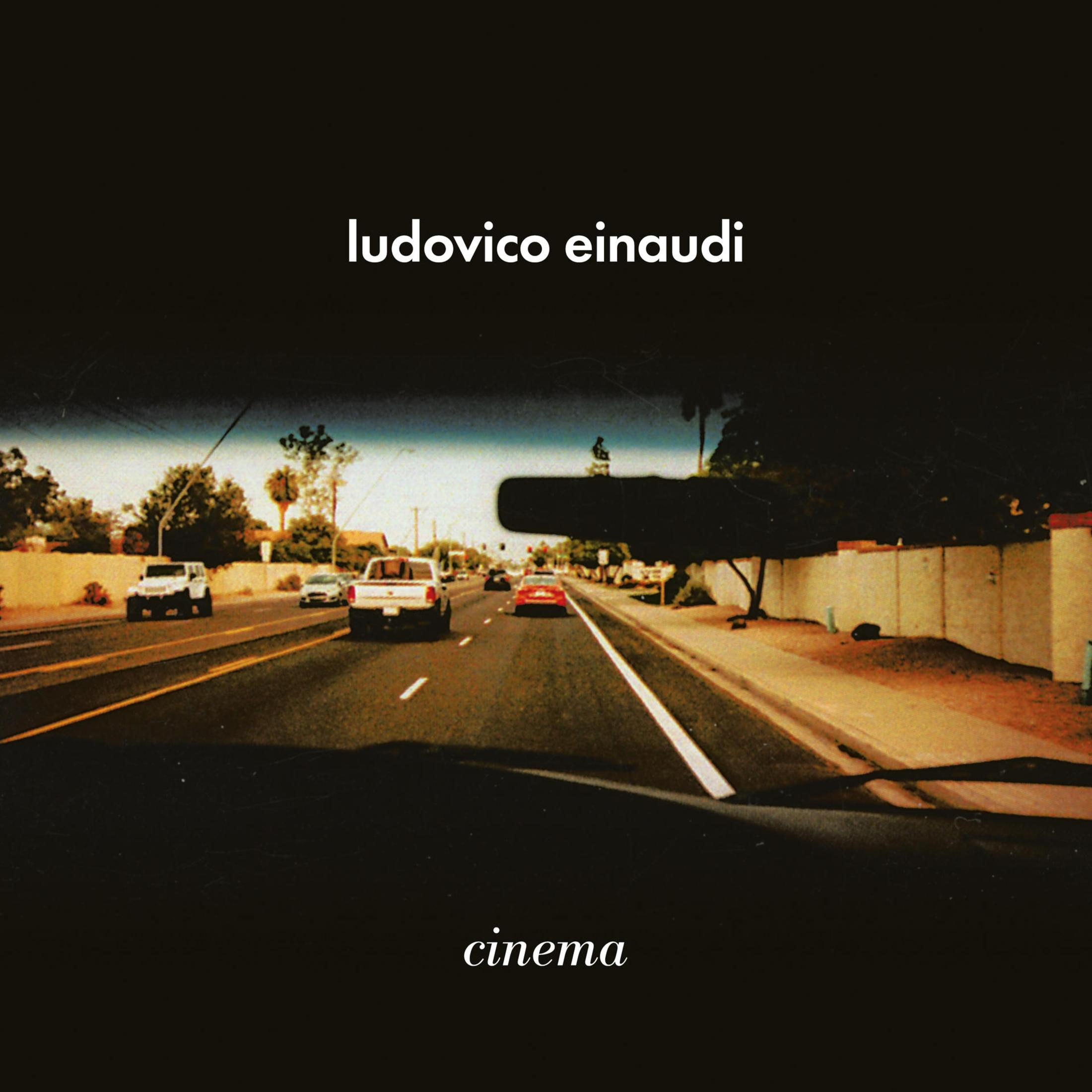 Copertina dell'album con una strada vuota con auto, cielo nero e il testo 'ludovico einaudi cinema'.
