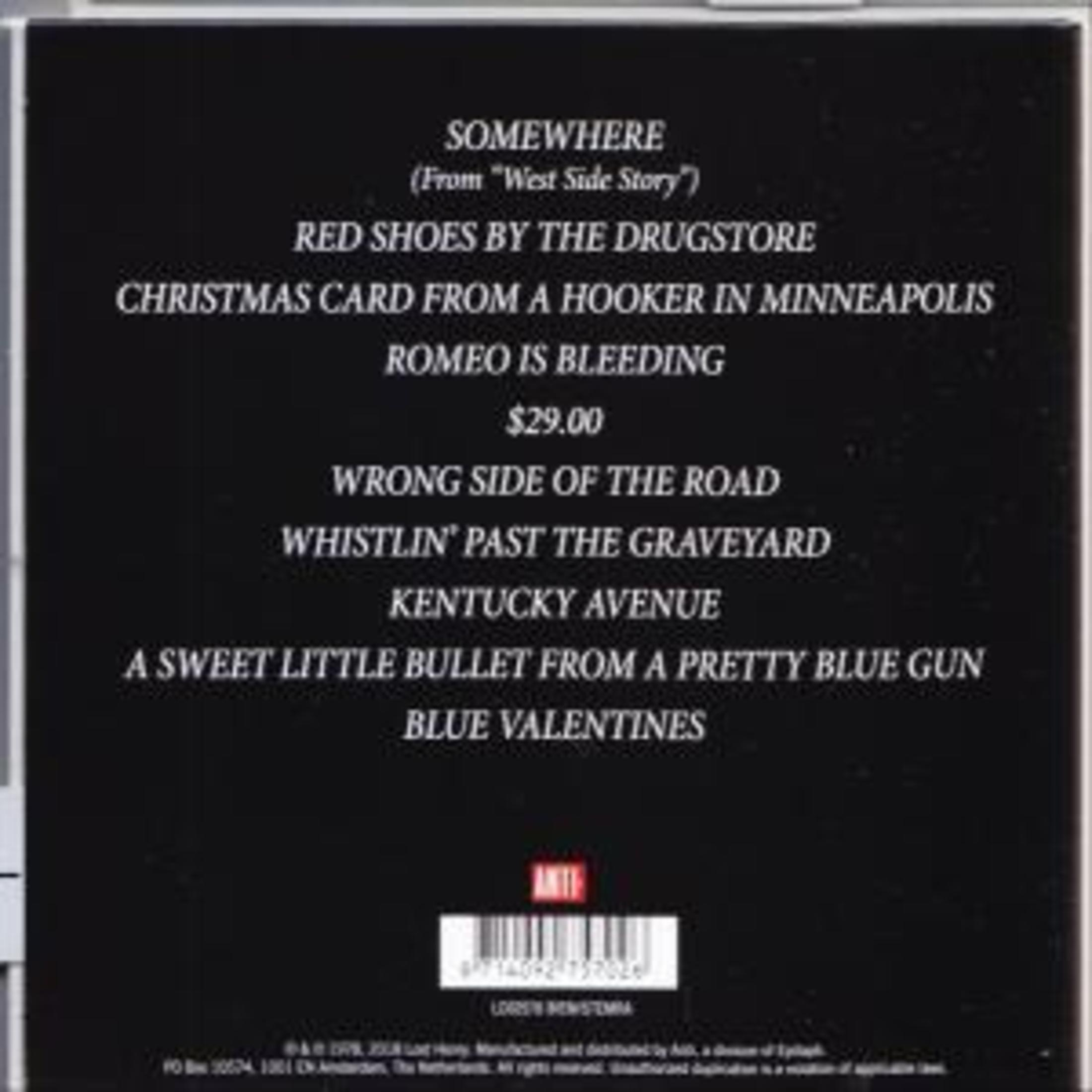 Copertina dell'album nera con titoli di canzoni. Include 'Somewhere', 'Red Shoes' e 'Christmas Card'.