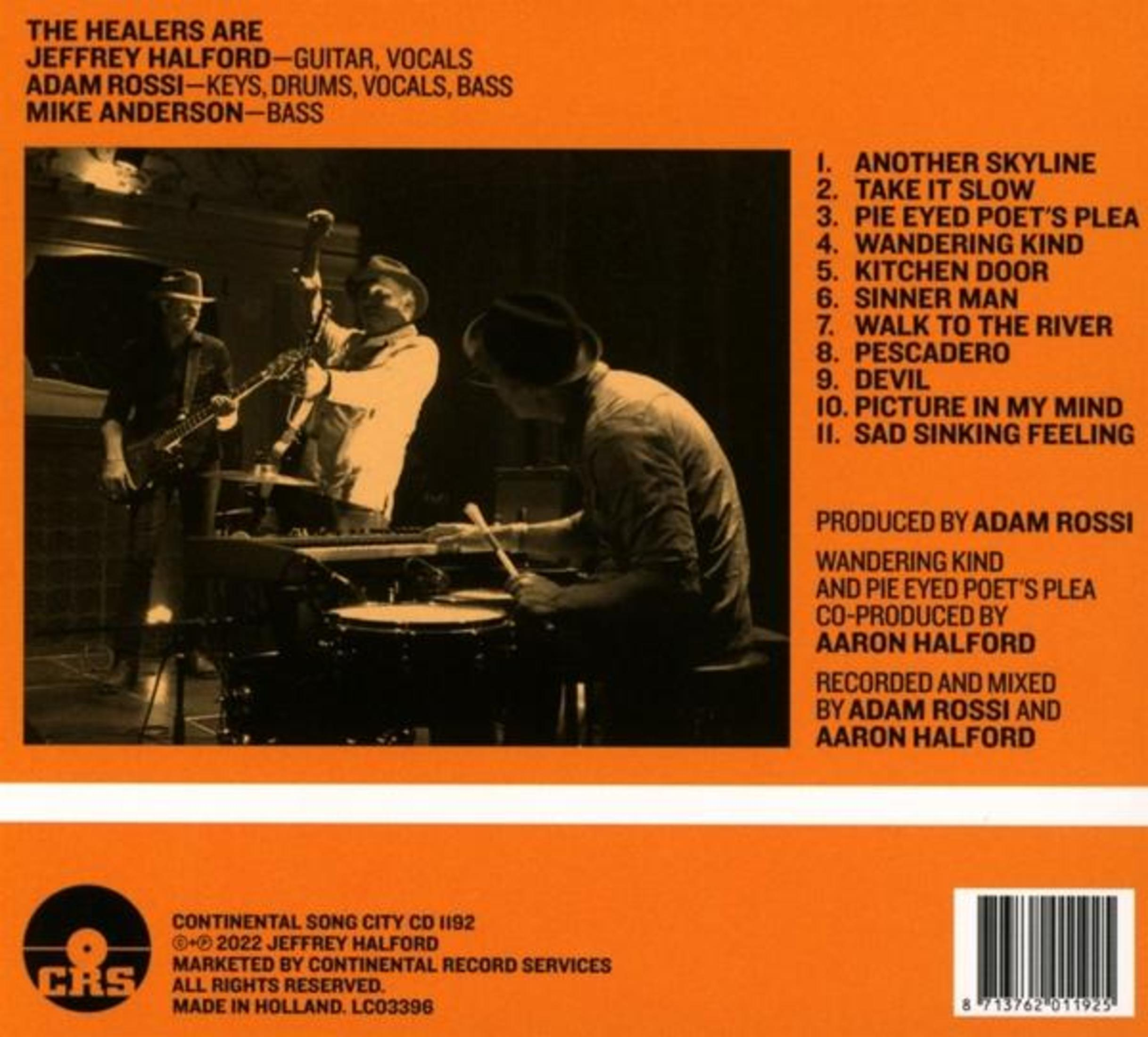 Pochette d'album : Trois musiciens jouant des instruments, avec du texte.