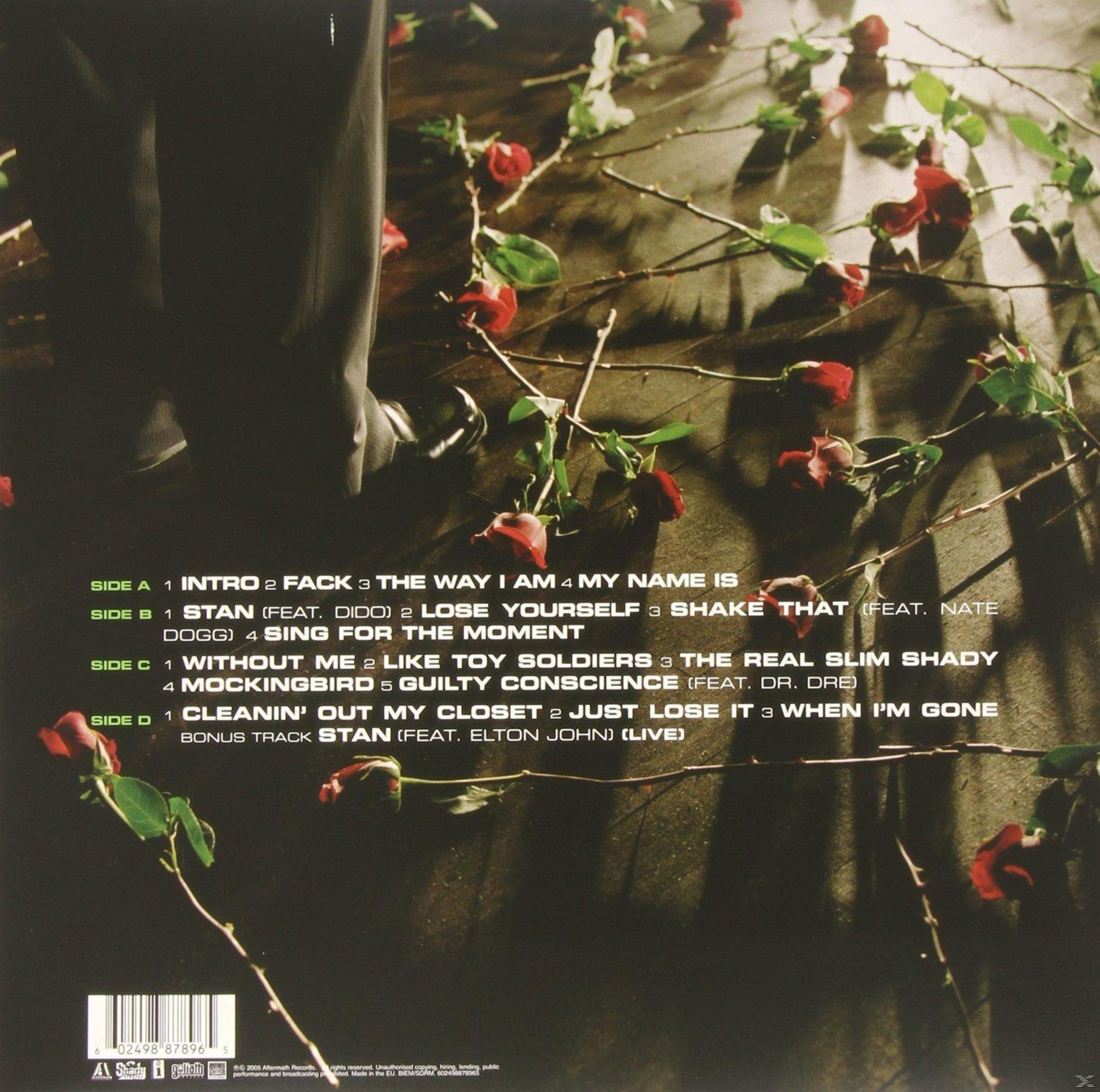 Retro copertina dell'album con rose e tracklist. Una gamba è visibile a sinistra. Testo bianco.