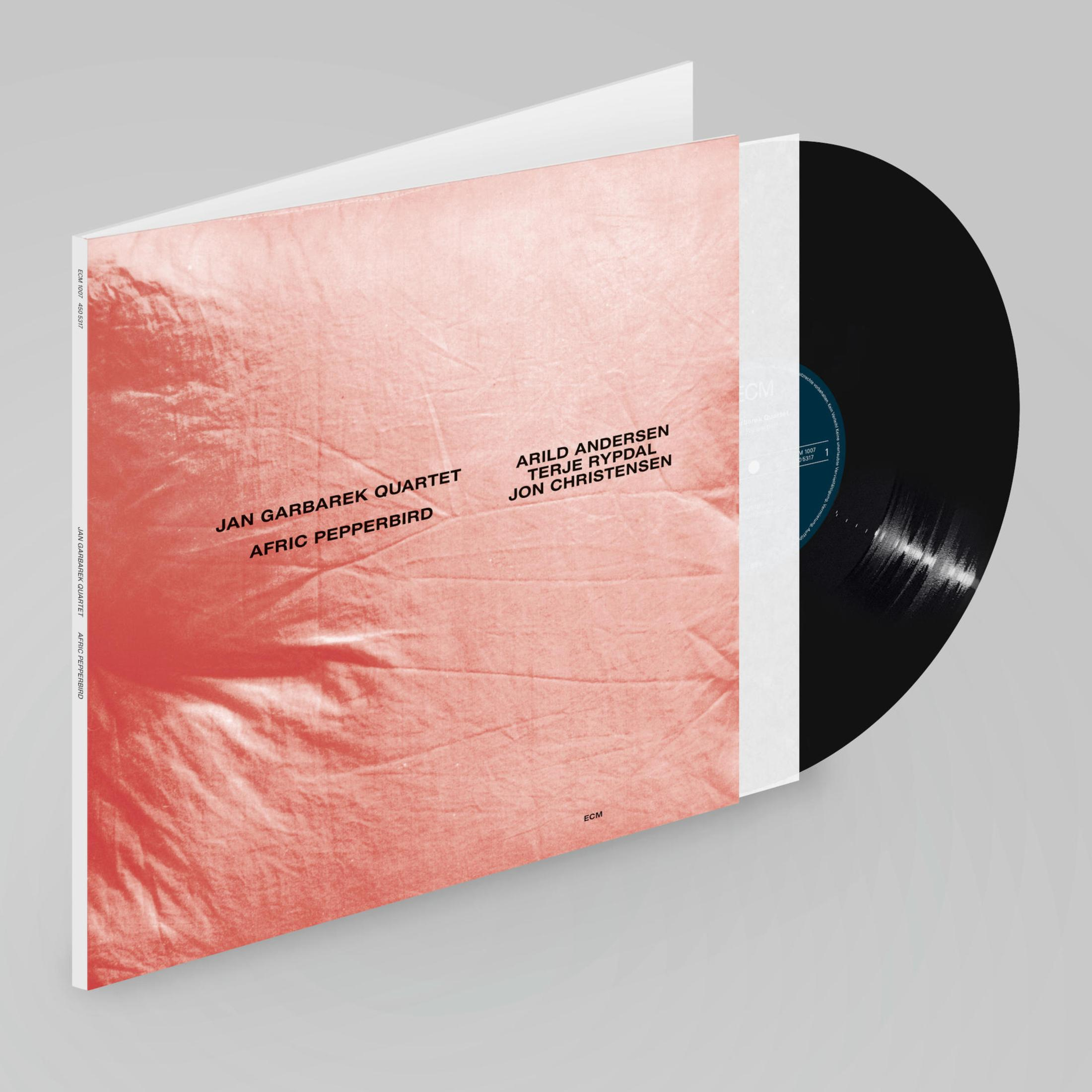 Portada del álbum con diseño rojo y blanco, y un disco de vinilo negro. Título del álbum a la izquierda.