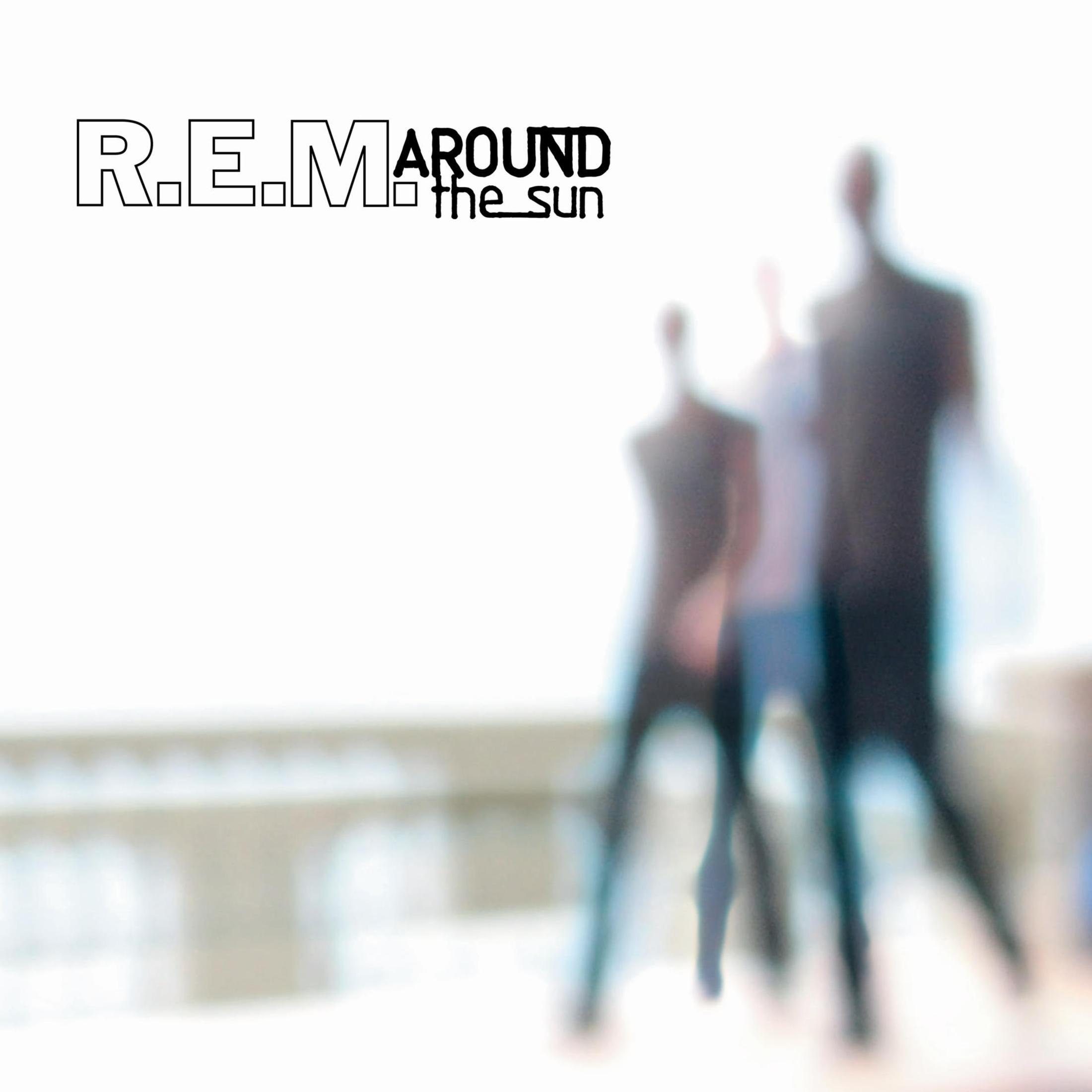 Album cover with blurred figures. White background and black text.