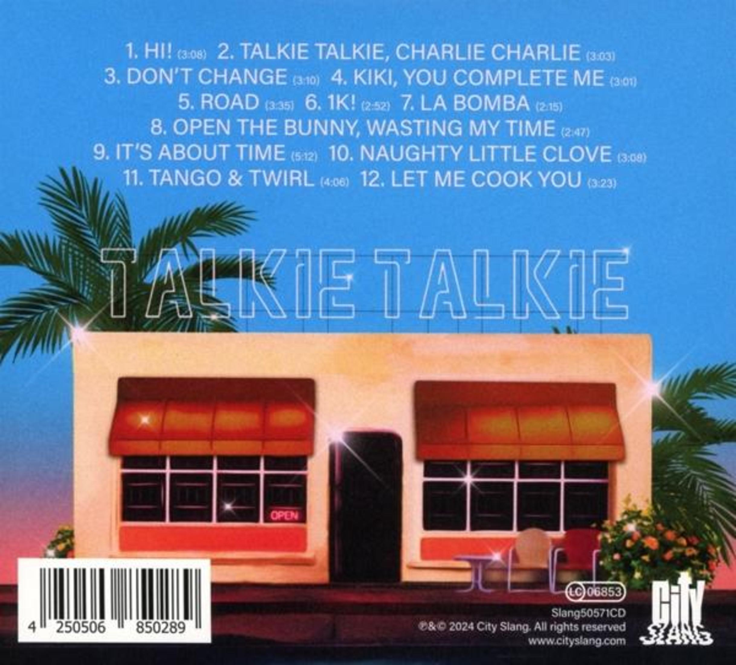 Portada del álbum con un edificio y texto. Palmeras.