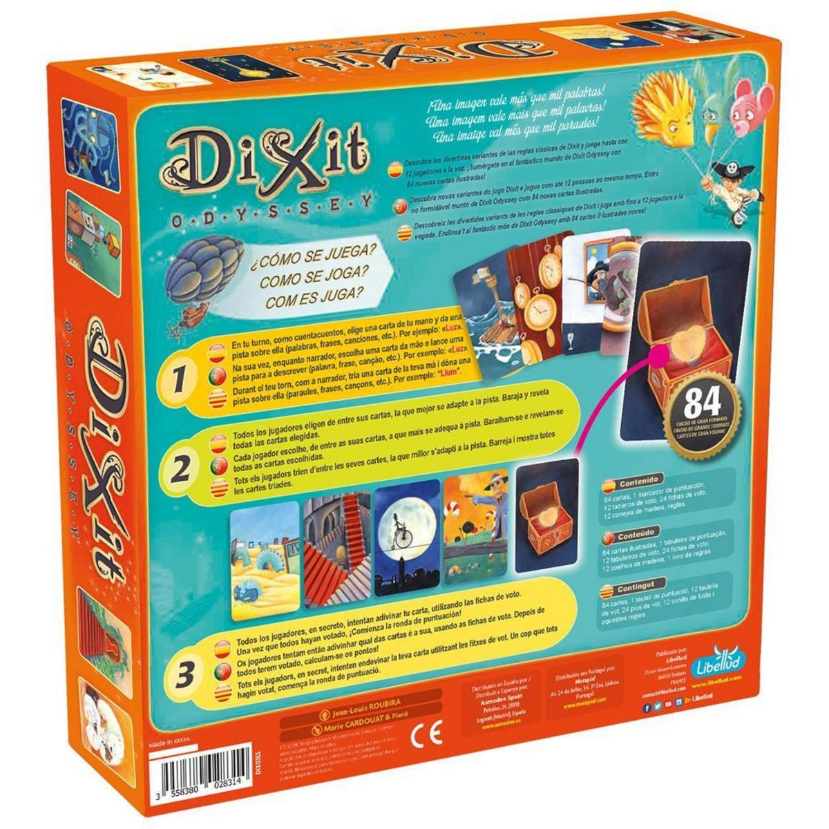 Caja del juego Dixit con ilustraciones. La caja del juego está abierta. Varias cartas están en la caja.