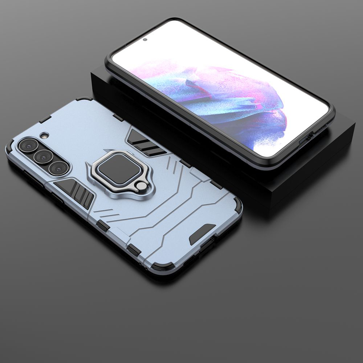 Blauwe telefoonhoes met ringstandaard, telefoon op zwart oppervlak, zwarte telefoon erboven.