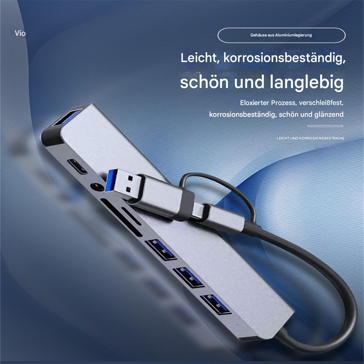 Ein silberner USB-Hub mit mehreren Anschlüssen und einem schwarzen Kabel. Text: 'Leicht, korrosionsbeständig, schön und langlebig'.