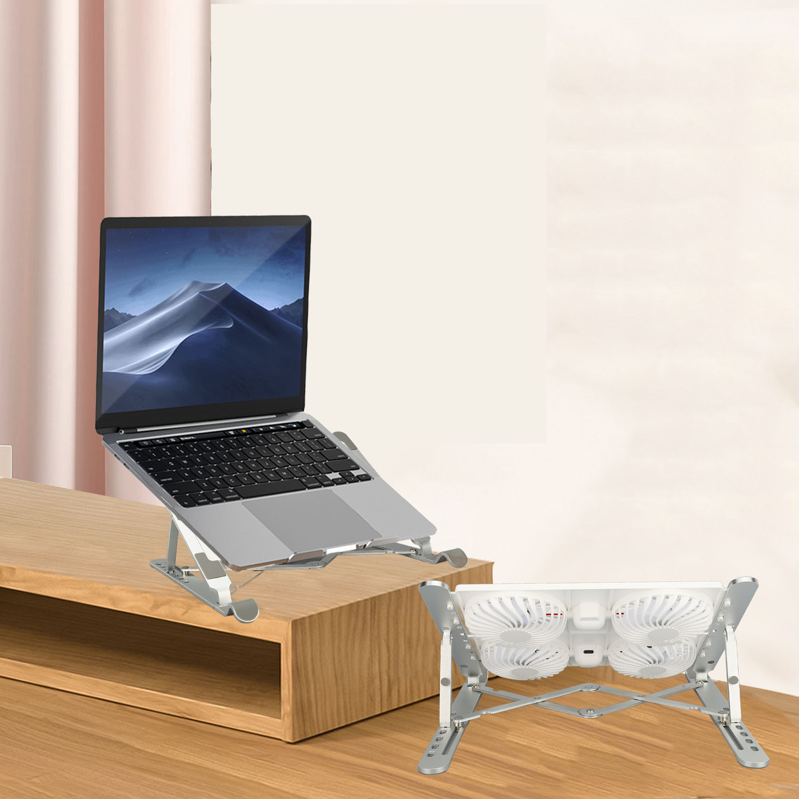 Laptop auf einem silbernen Ständer, Ventilatoren unten. Rosa Vorhang und weiße Wand im Hintergrund.
