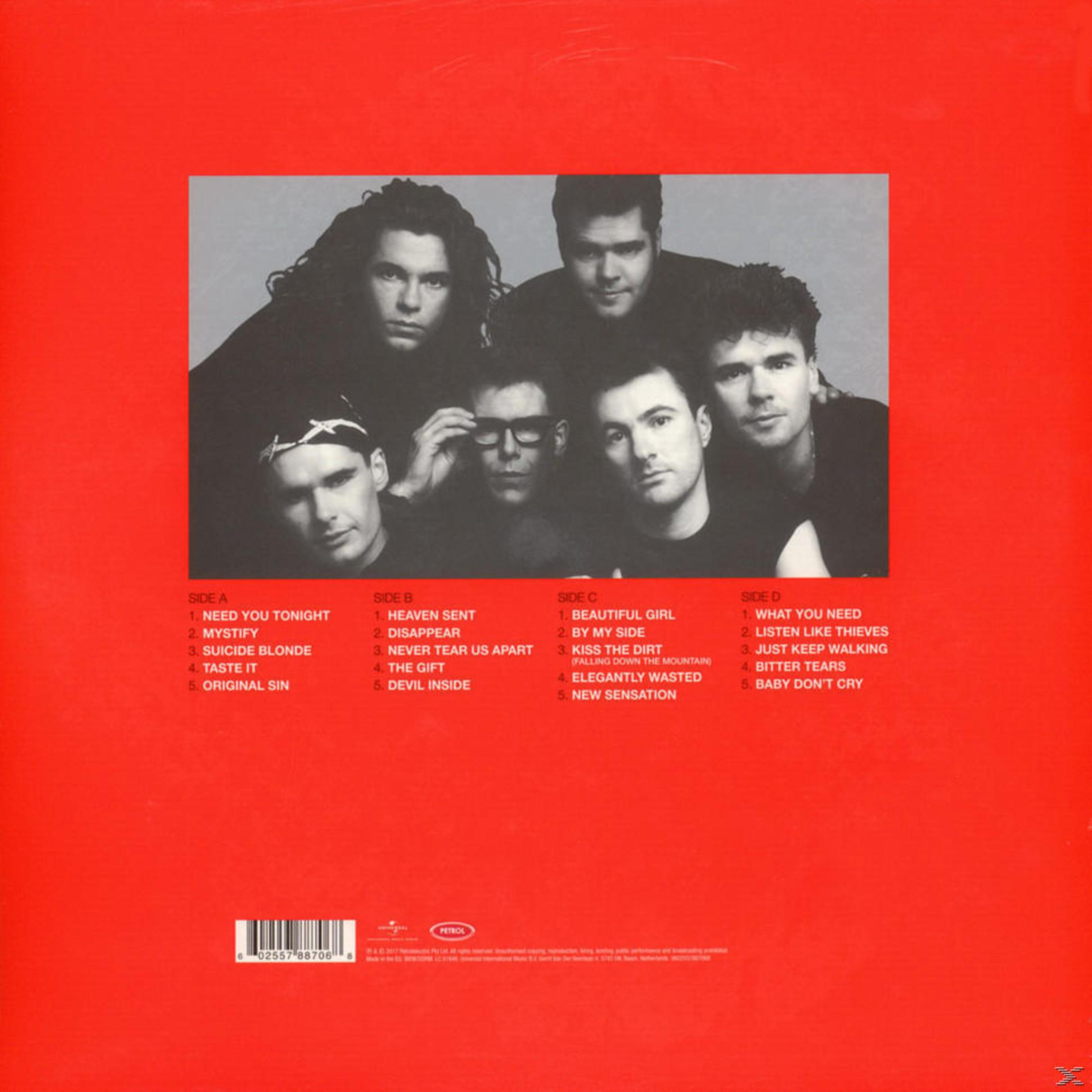 Retro copertina dell'album con foto in bianco e nero di sei uomini. Tracklist su sfondo rosso.