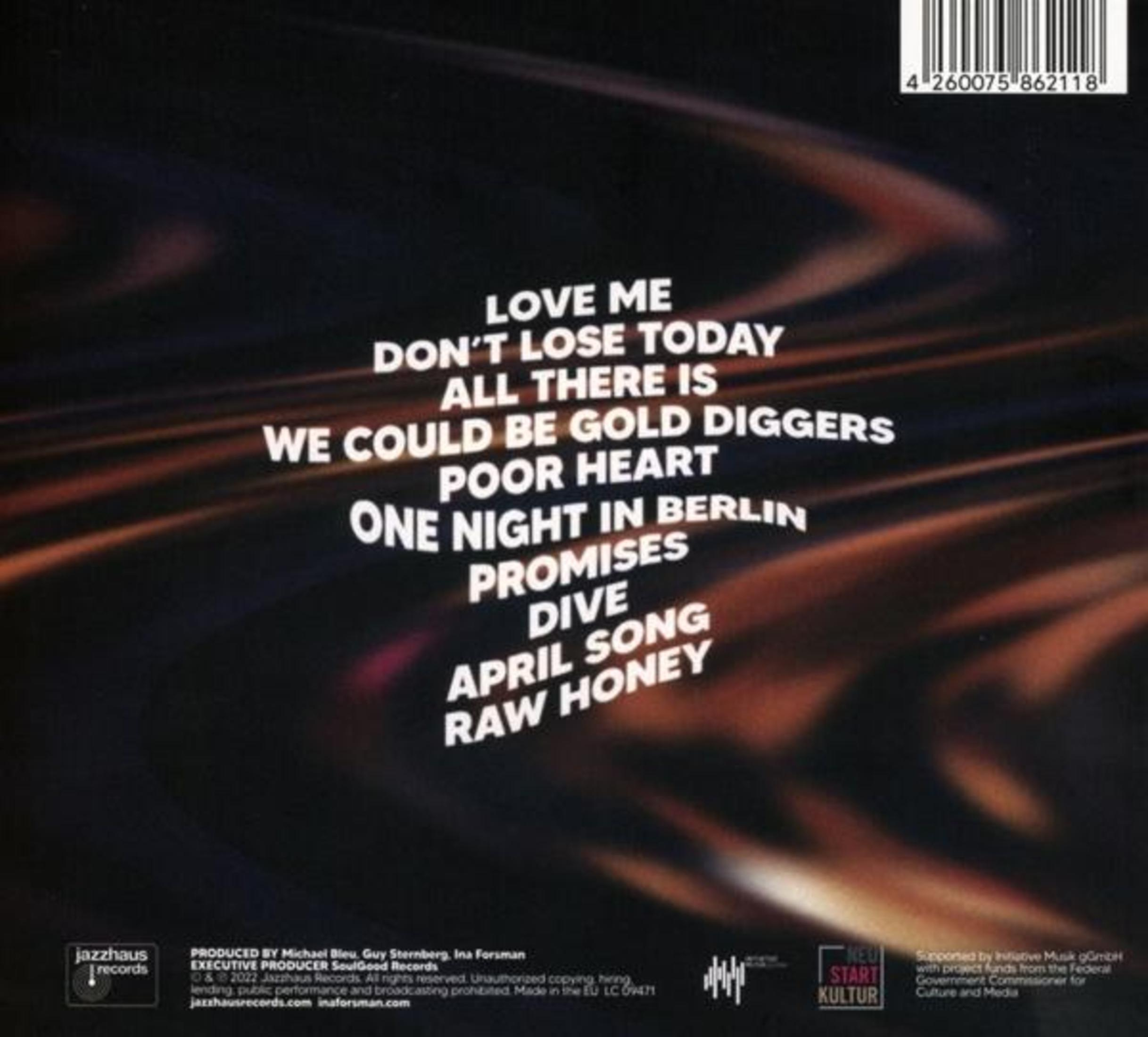 Dos d'un boîtier de CD, avec liste des titres et texte en bas. Fond marron foncé.