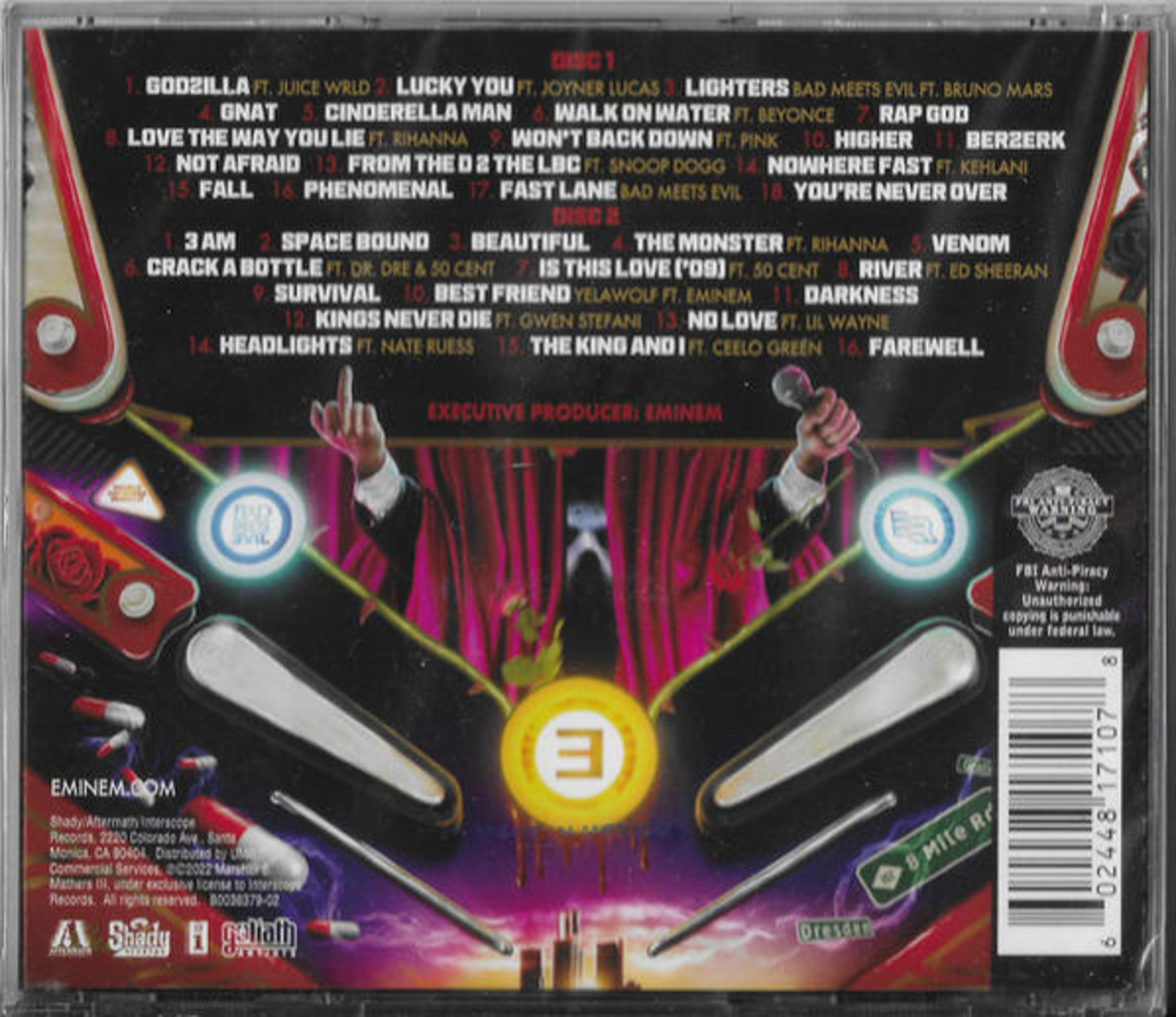 Album cover with a man giving the finger and holding a microphone. Text and graphics are visible.