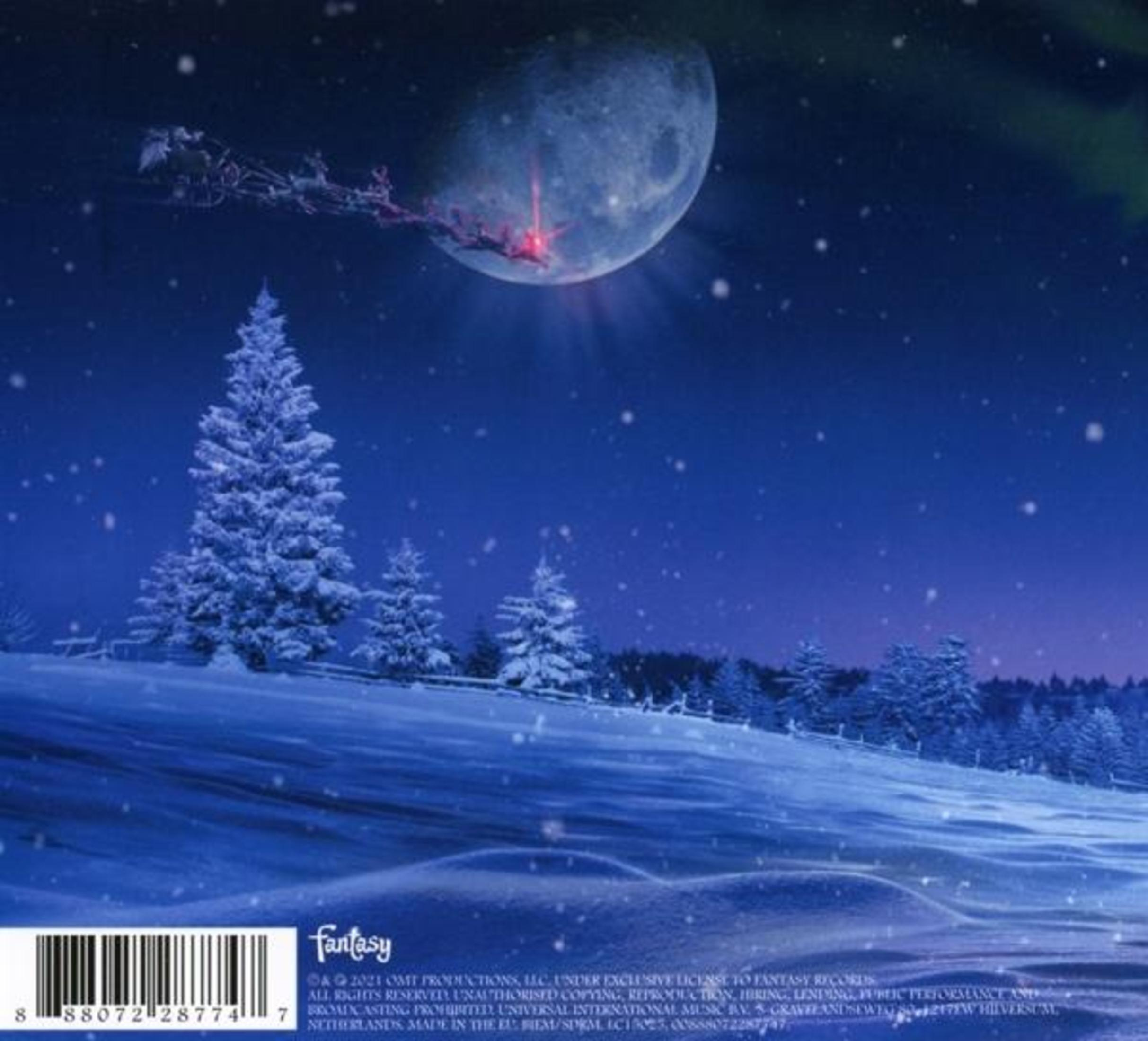 Copertina dell'album. Scena invernale con alberi innevati e luna piena. Slitta di Babbo Natale.