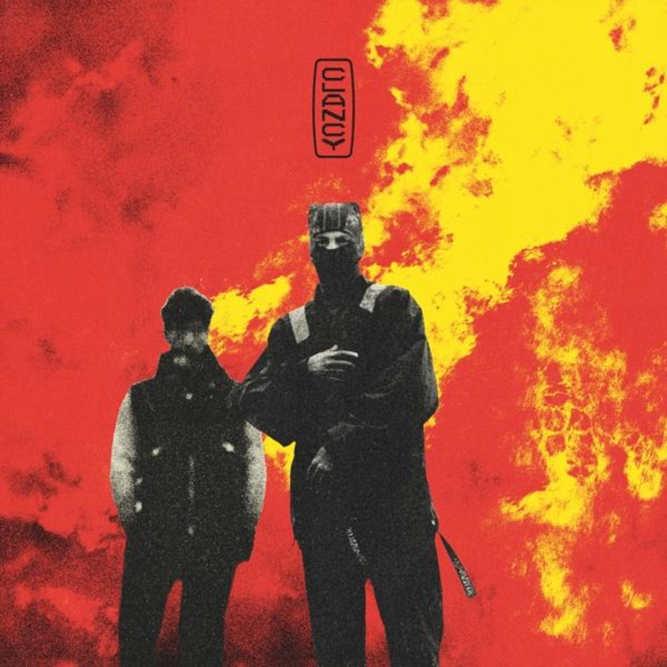 Copertina dell'album, due uomini in abiti scuri, sfondo rosso e giallo.