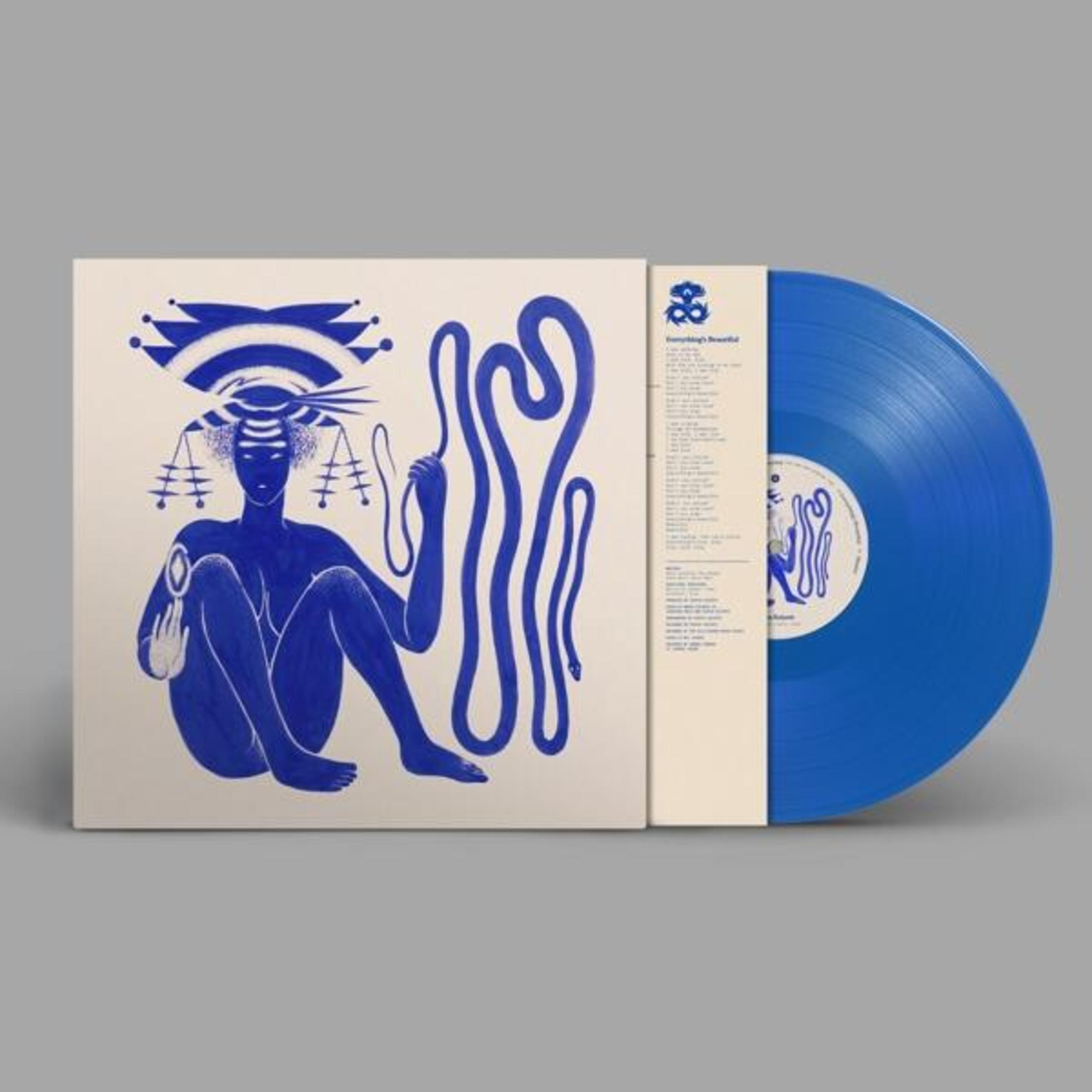 Copertina dell'album: Un disco in vinile blu con un disegno di una figura e serpenti. Testo: Everything's Beautiful.